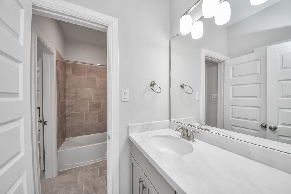 Third full bathroom with double vanities & double sinks.