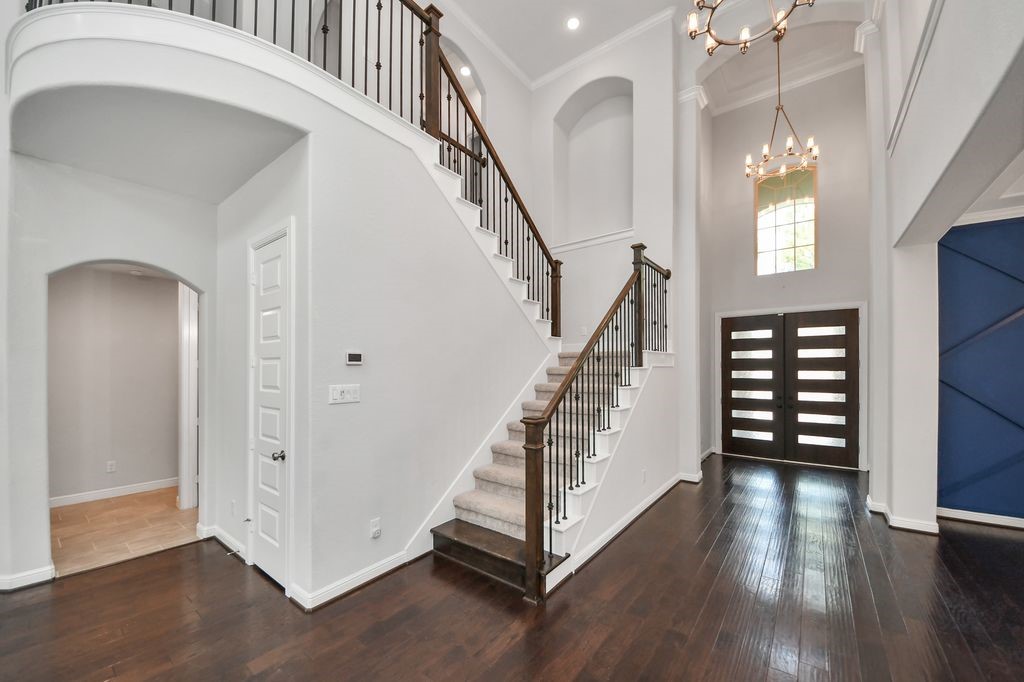 Wrought iron railings adorn this staircase.