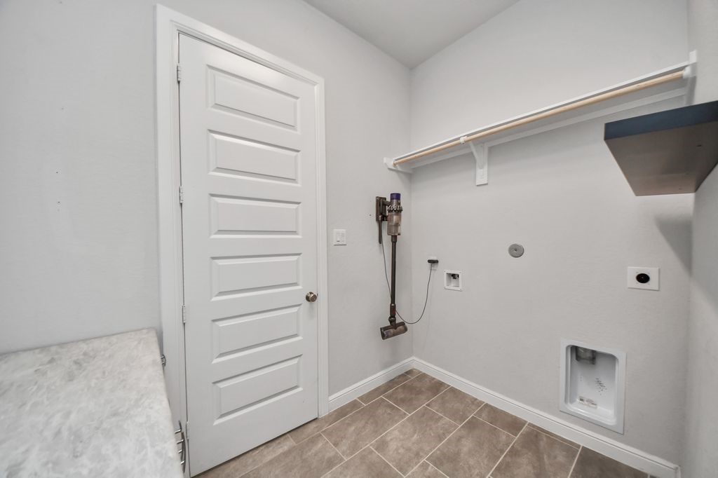 Large utility room with a folding shelf & room for a refrigerator. (fridge is included!)