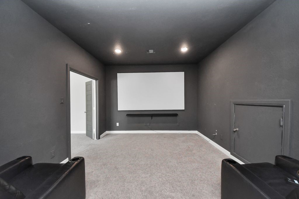 Media room with projector, screen and theater seating including!