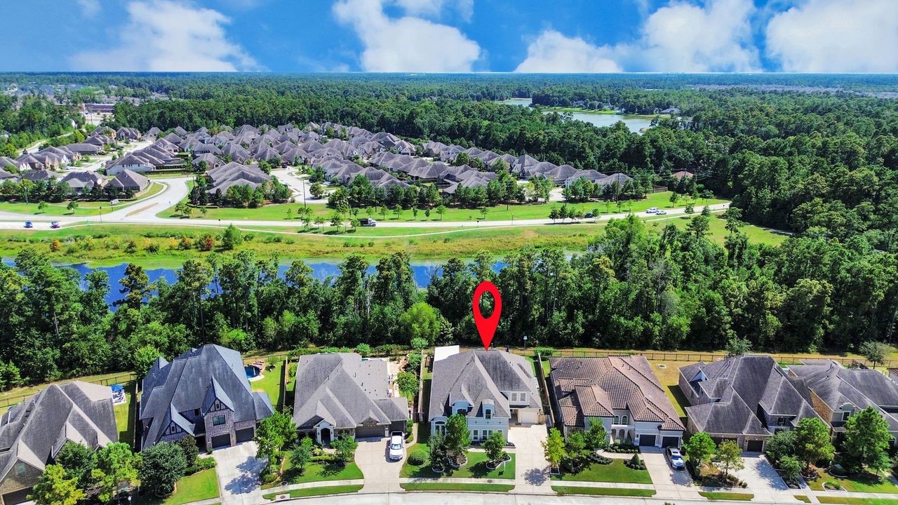 Look at this gorgeous greenbelt and pond behind the home!