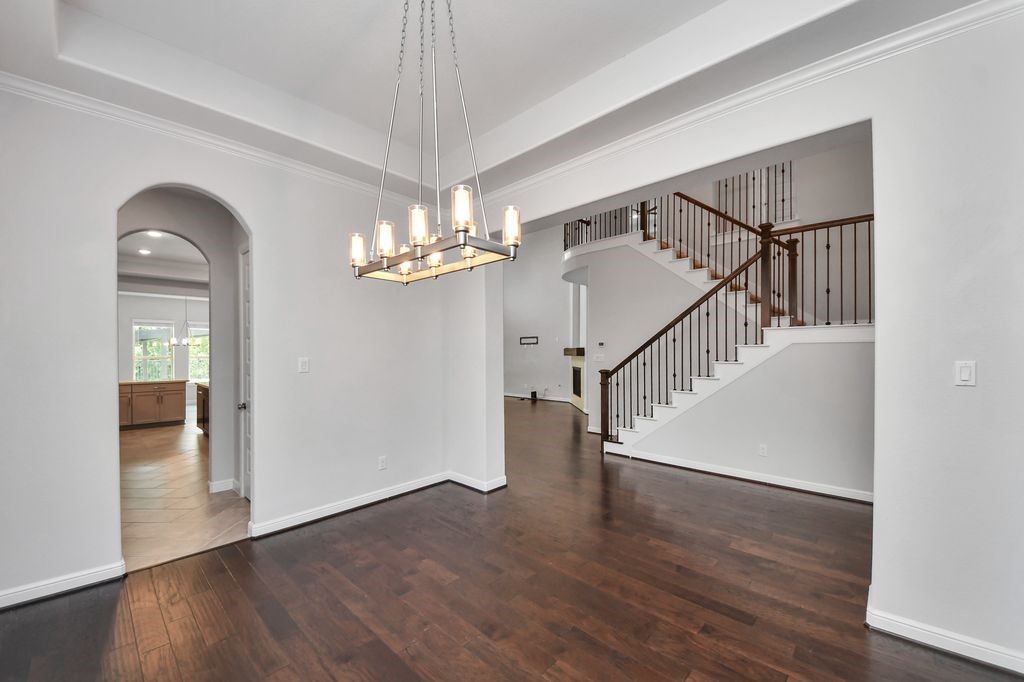 View from the formal dining room into the stairway area and entrance to the butler's pantry & kitchen.