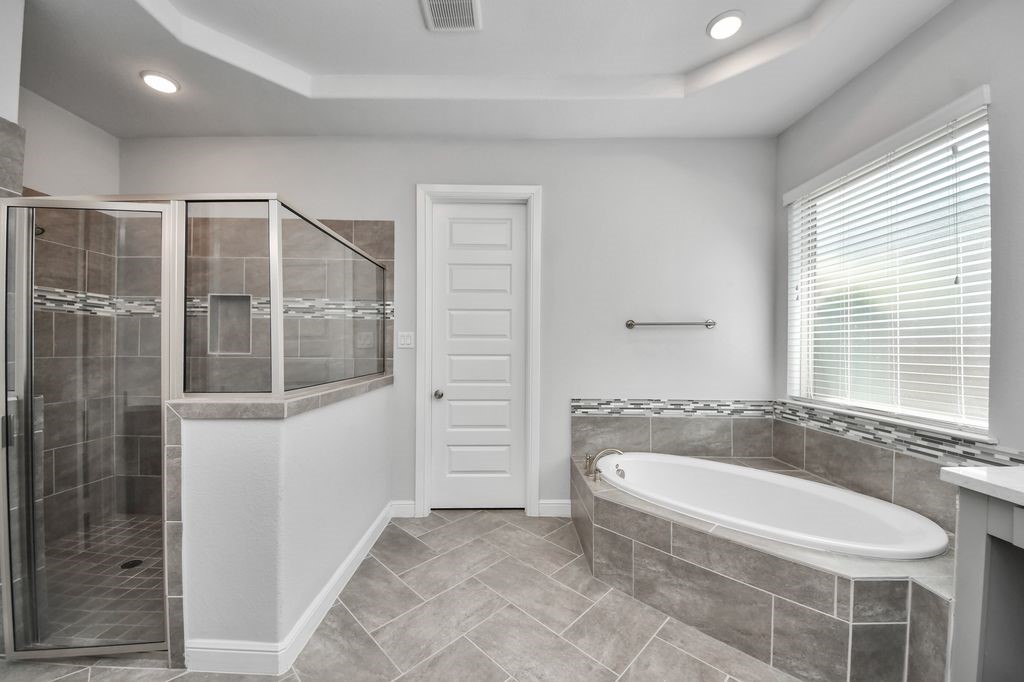 The shower has a built-in bench!