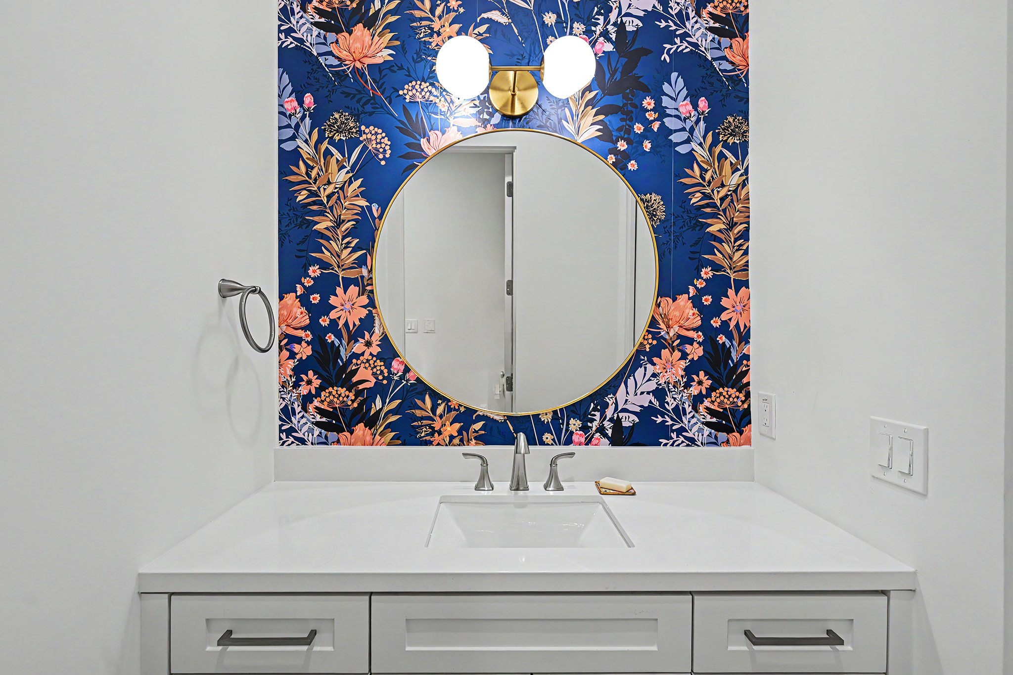 The second vanity introduces another layer of color and pattern to the beautifully finished Hollywood bath.