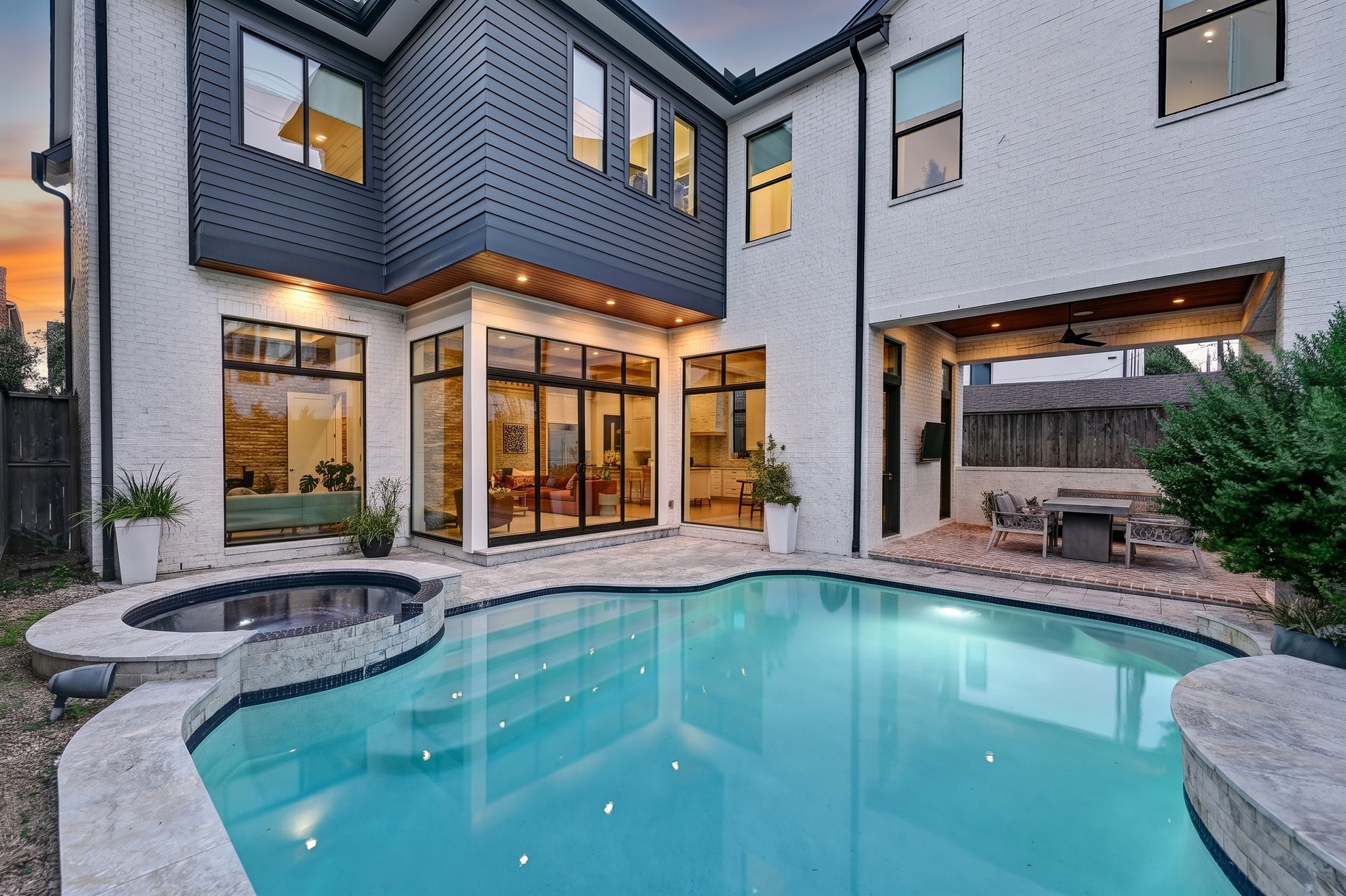 The heated pool and attached spa create a private outdoor retreat framed by the homes striking architecture.