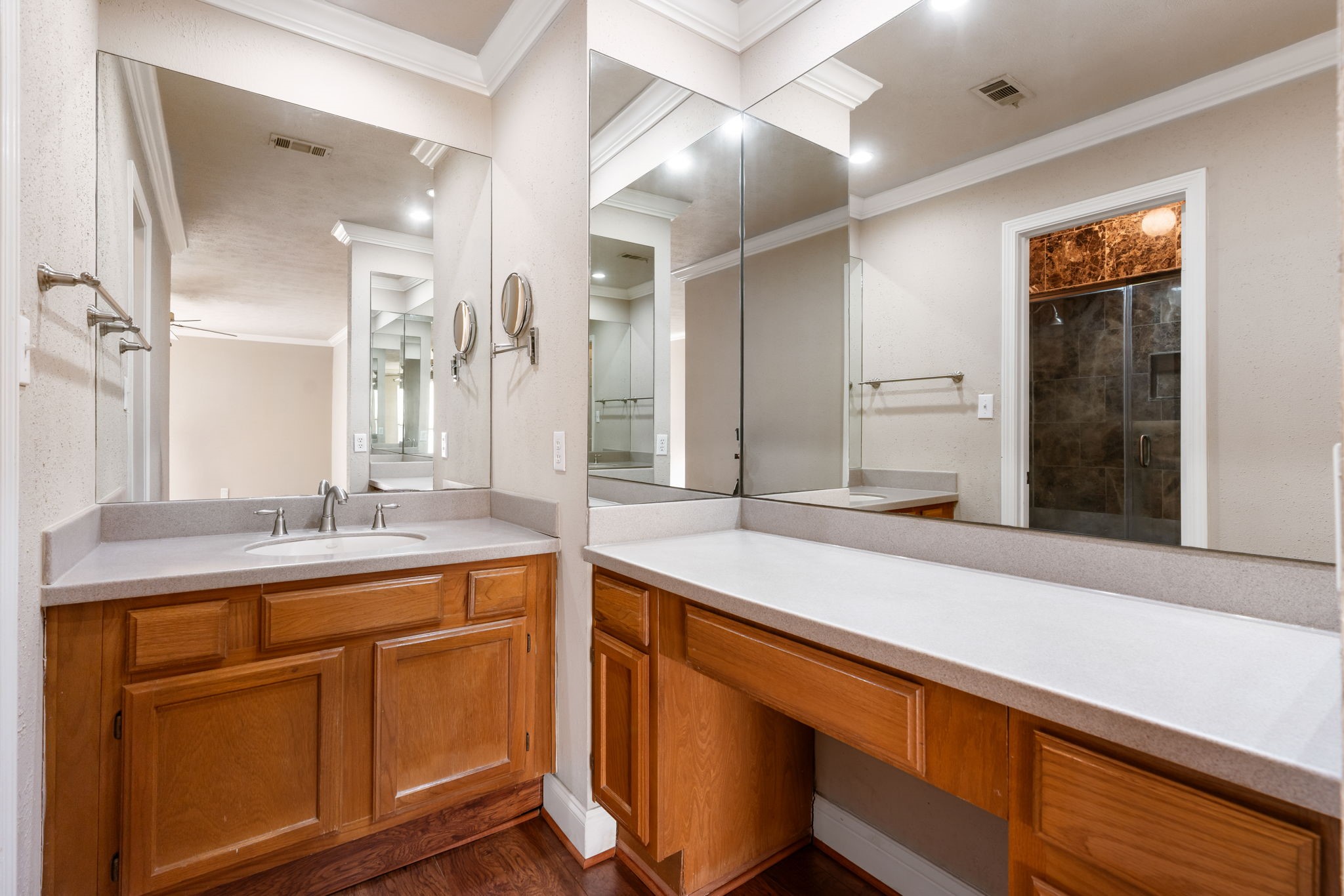 Primary bathroom with plenty of countertop space and vanity