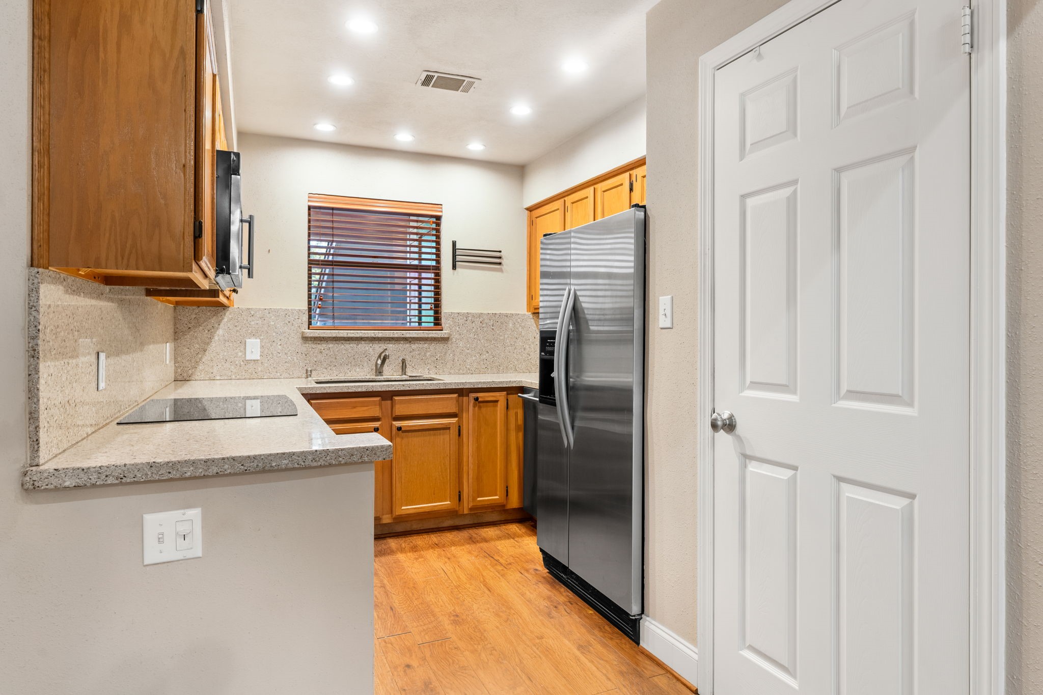 Granite counter tops and backsplash kitchen open to the living and dining area
