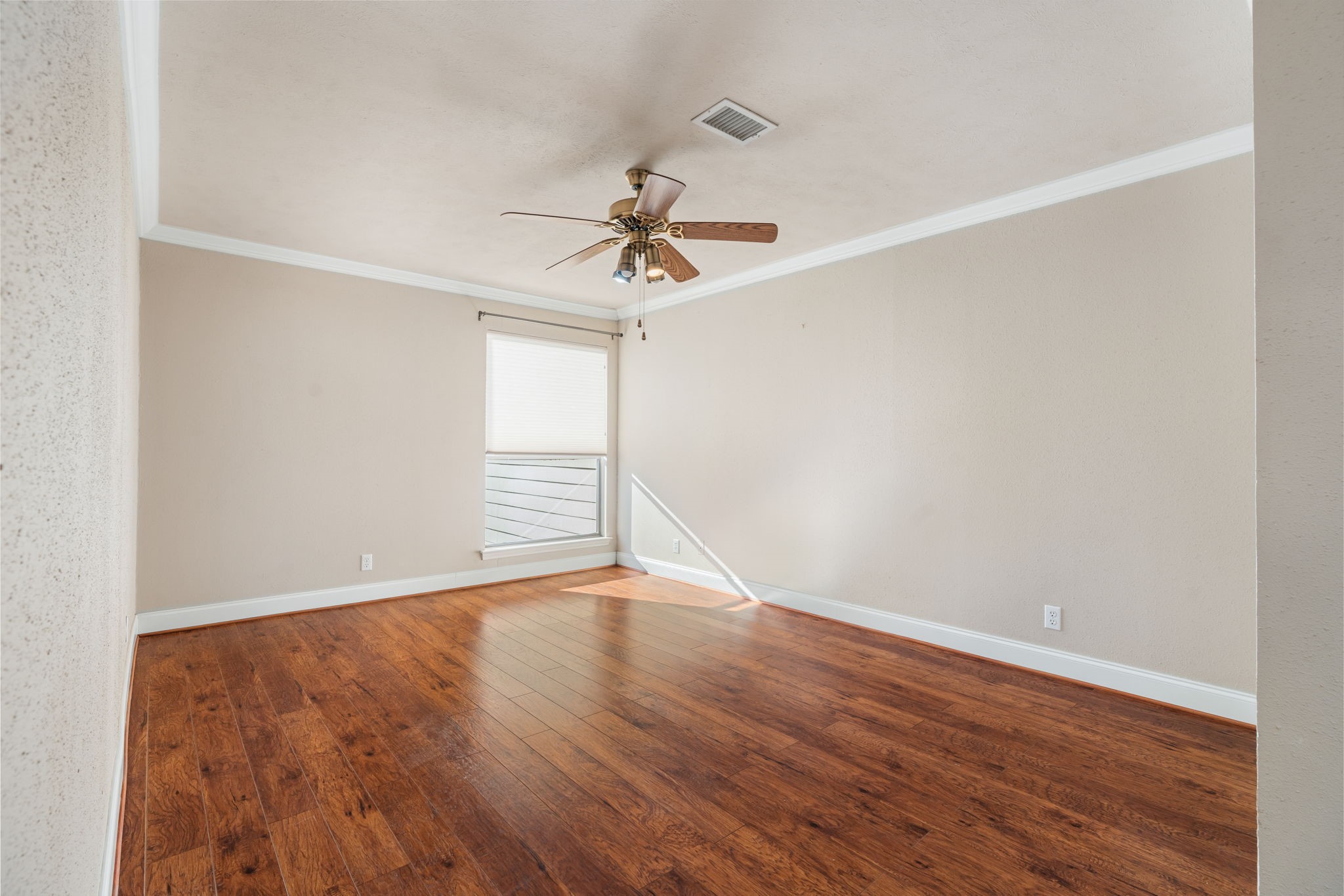 Primary bedroom with crown molding