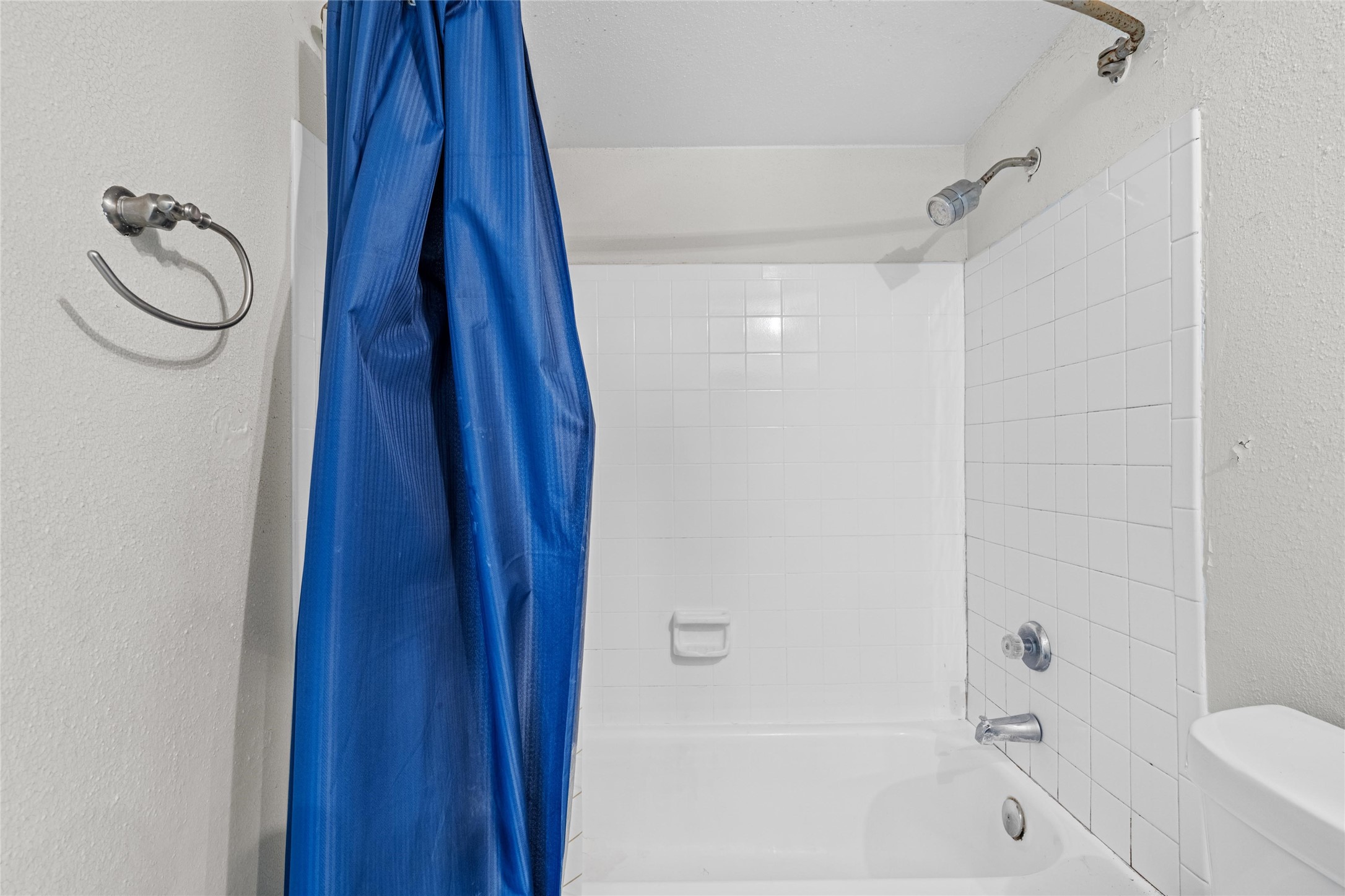 Full bathroom includes a tub and shower combination with convenient everyday functionality.