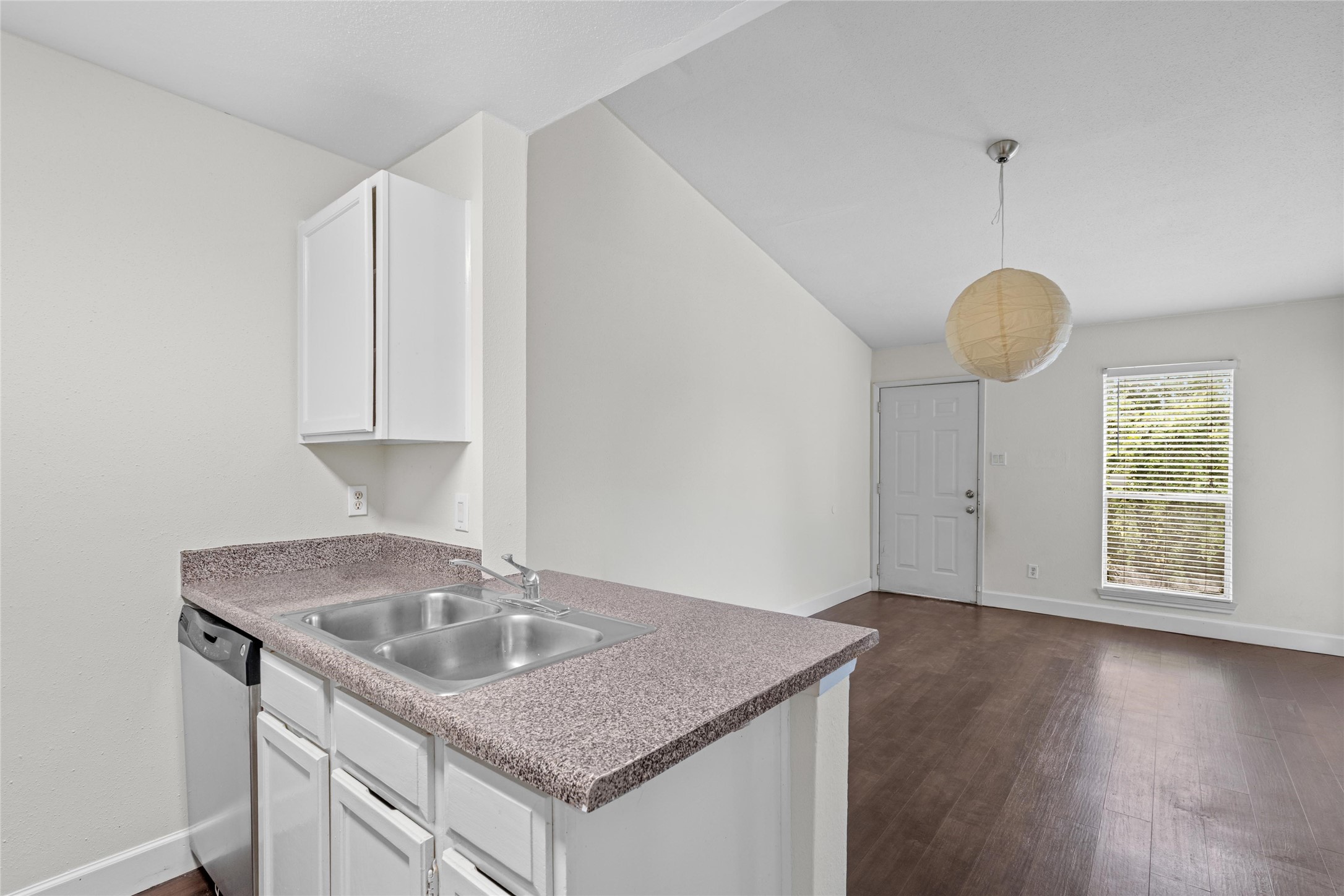 Open view from the kitchen showcases its connection to the adjoining living area and overall functional layout.