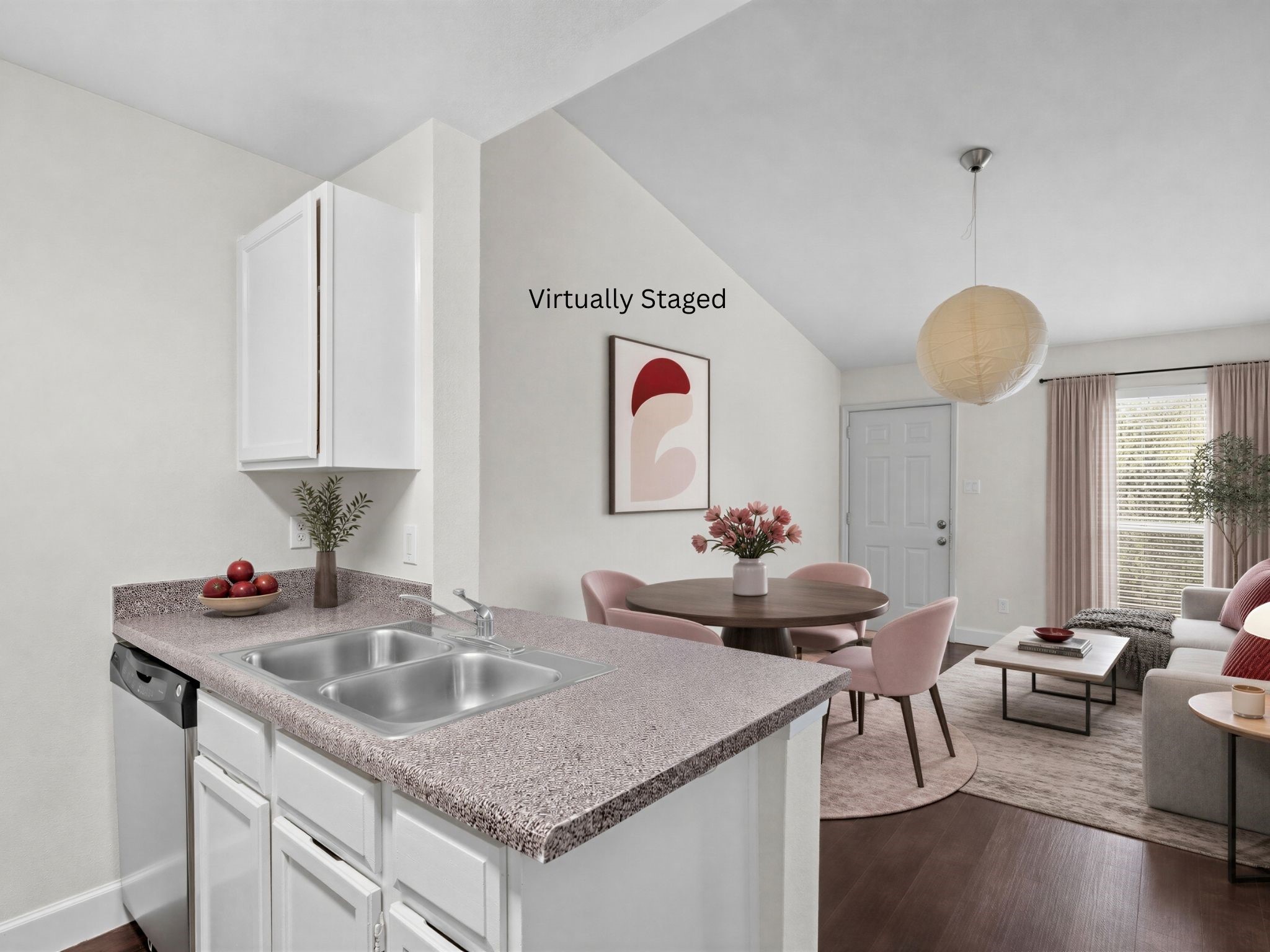 Virtually staged for visualization purposes only; furnishings are not included. Open sightlines connect the kitchen with the adjoining dining and living areas.