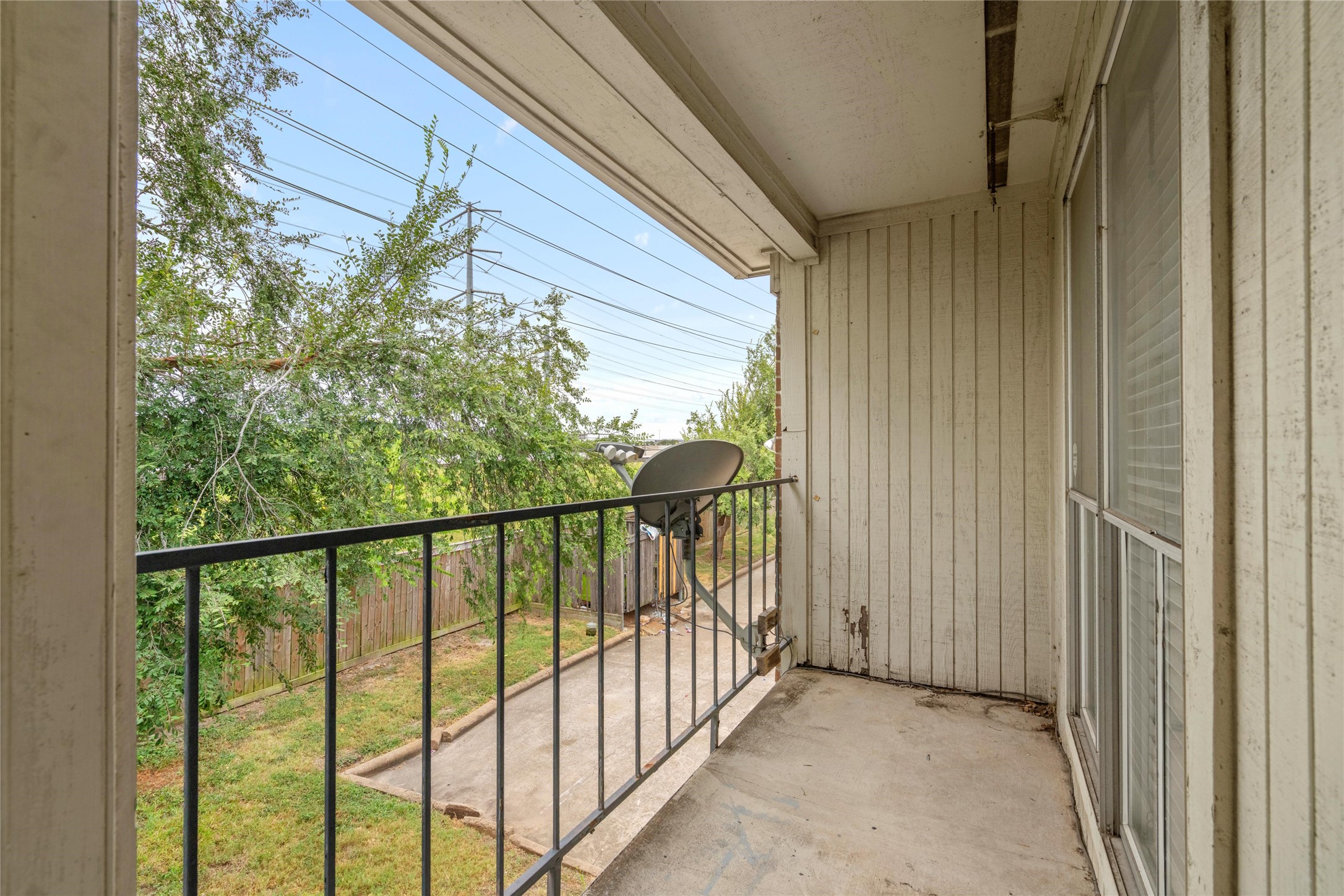 Private second-floor balcony extends the living space outdoors and provides an opportunity to create a comfortable outdoor retreat.