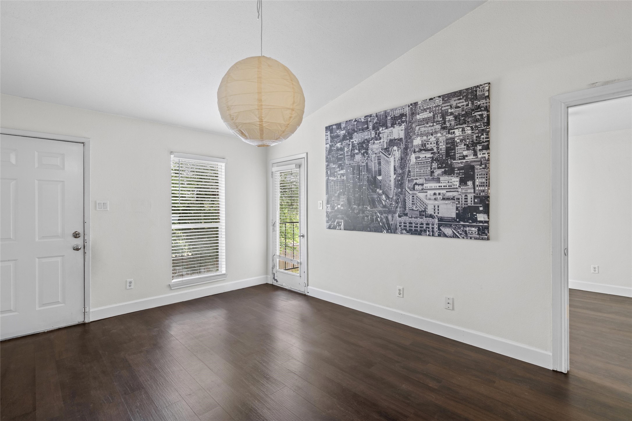 Another perspective, you can see the full layout of the living room/dining area opening to the room.