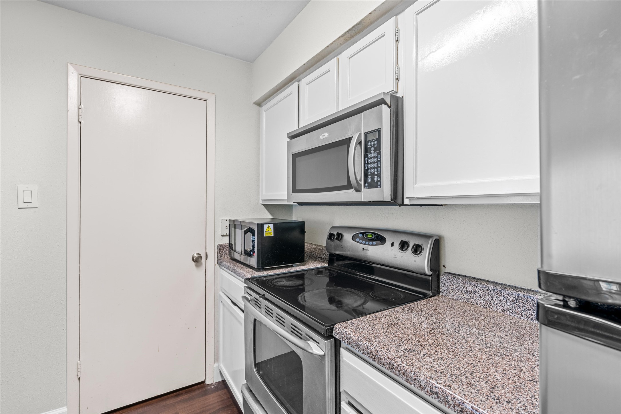 Kitchen layout provides practical workspace with ample cabinetry and countertop area.