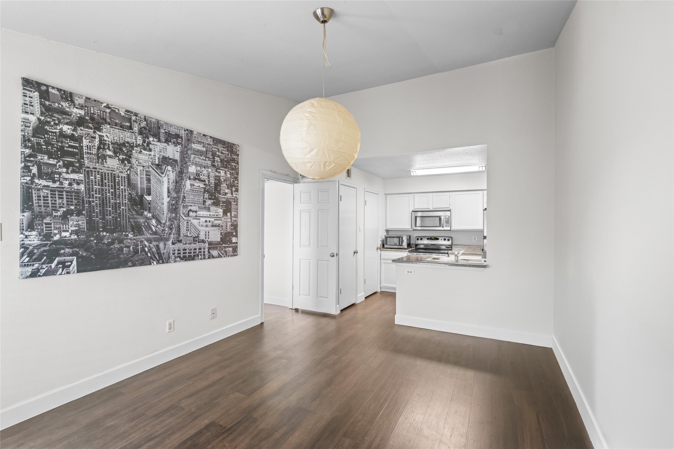 Open living and dining area provides versatile space for everyday living, entertaining, or creating a layout tailored to the new owner's needs. Open living and dining area provides versatile space for everyday living, entertaining, or creating a layout tailored to the new owner's needs.