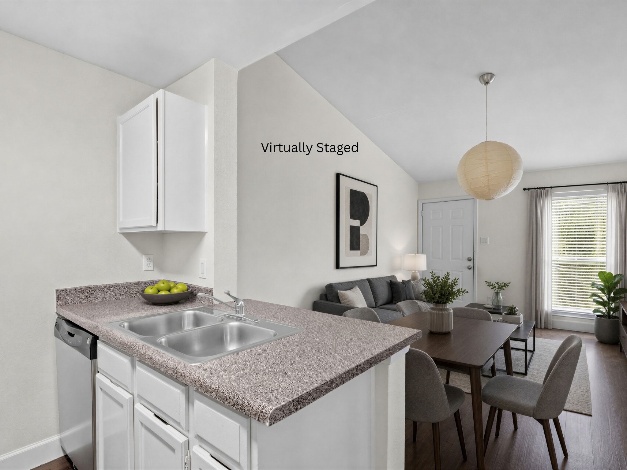 Virtually staged for visualization purposes only; furnishings are not included. Kitchen opens toward the dining area, creating an efficient and connected living space. Virtually staged for visualization purposes only; furnishings are not included. Kitchen opens toward the dining area, creating an efficient and connected living space.