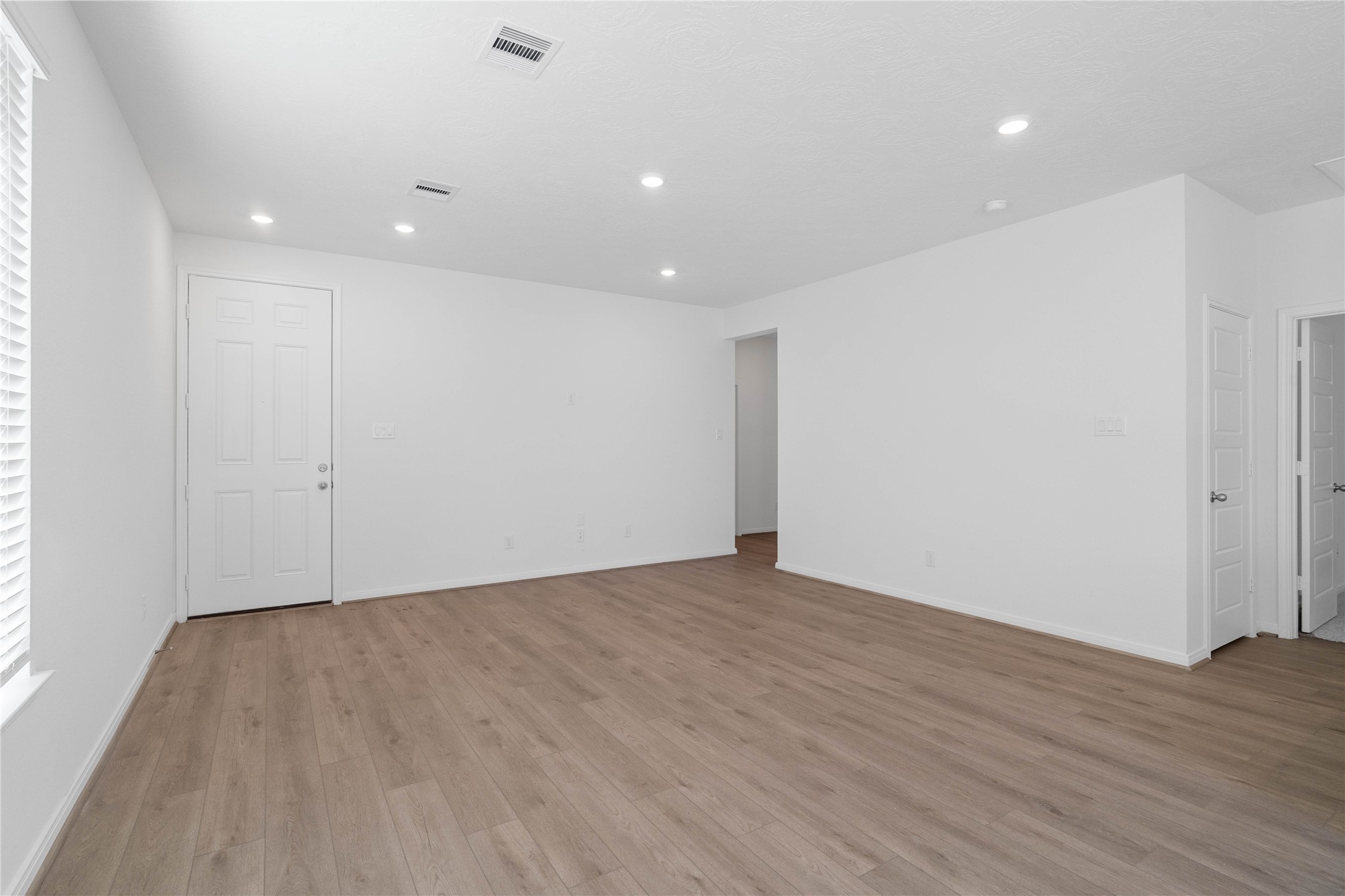 Enter your new home at 5619 Blackbird Lane and be welcomed by the Layton Lake vinyl plank flooring in Soft Beige, and fresh, bright paint that combine to create a warm and inviting space.