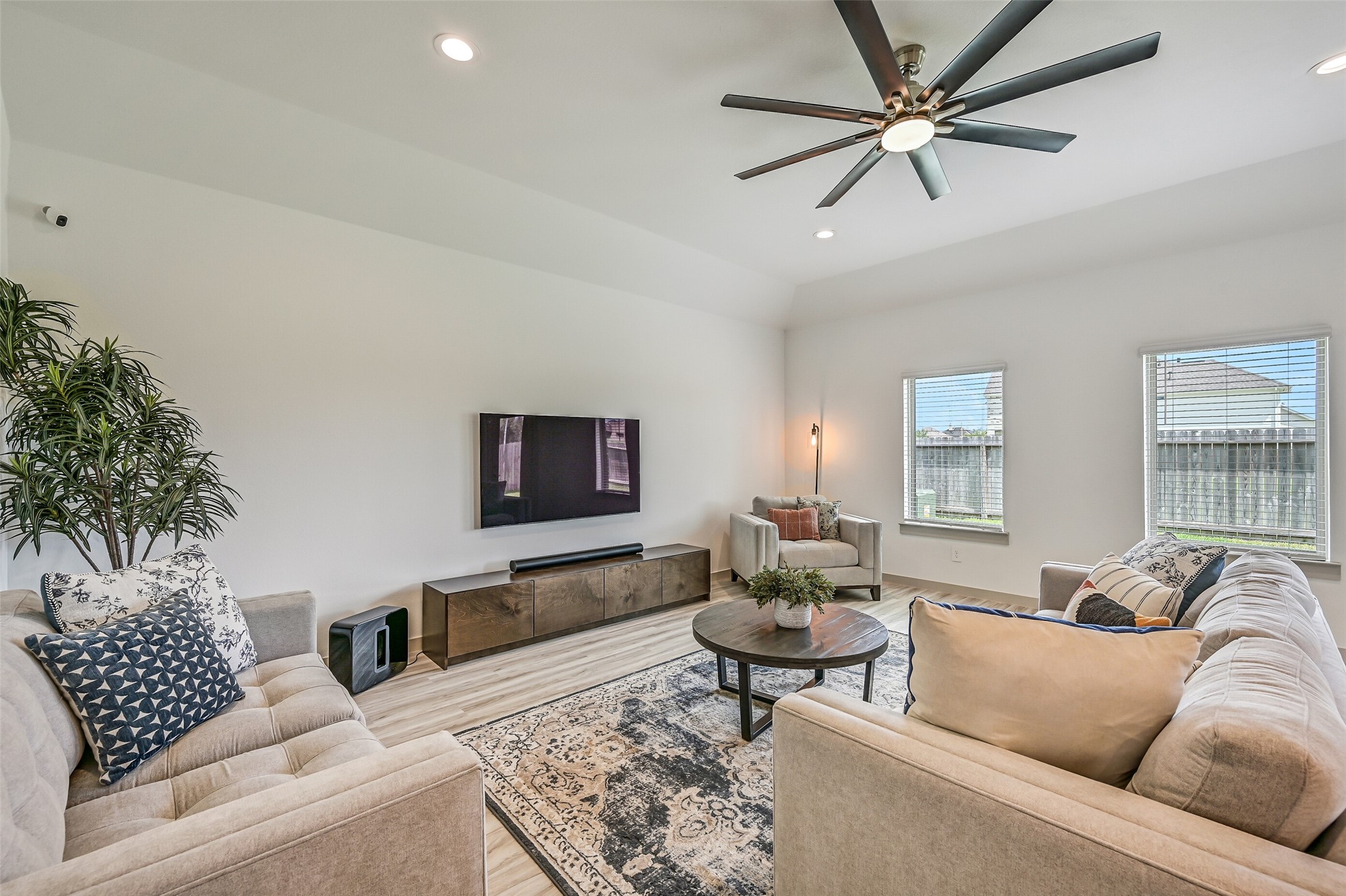 With ample room for multiple seating arrangements, the inviting family room offers plenty of space to gather and relax while remaining completely open to the island kitchen and dining area.
