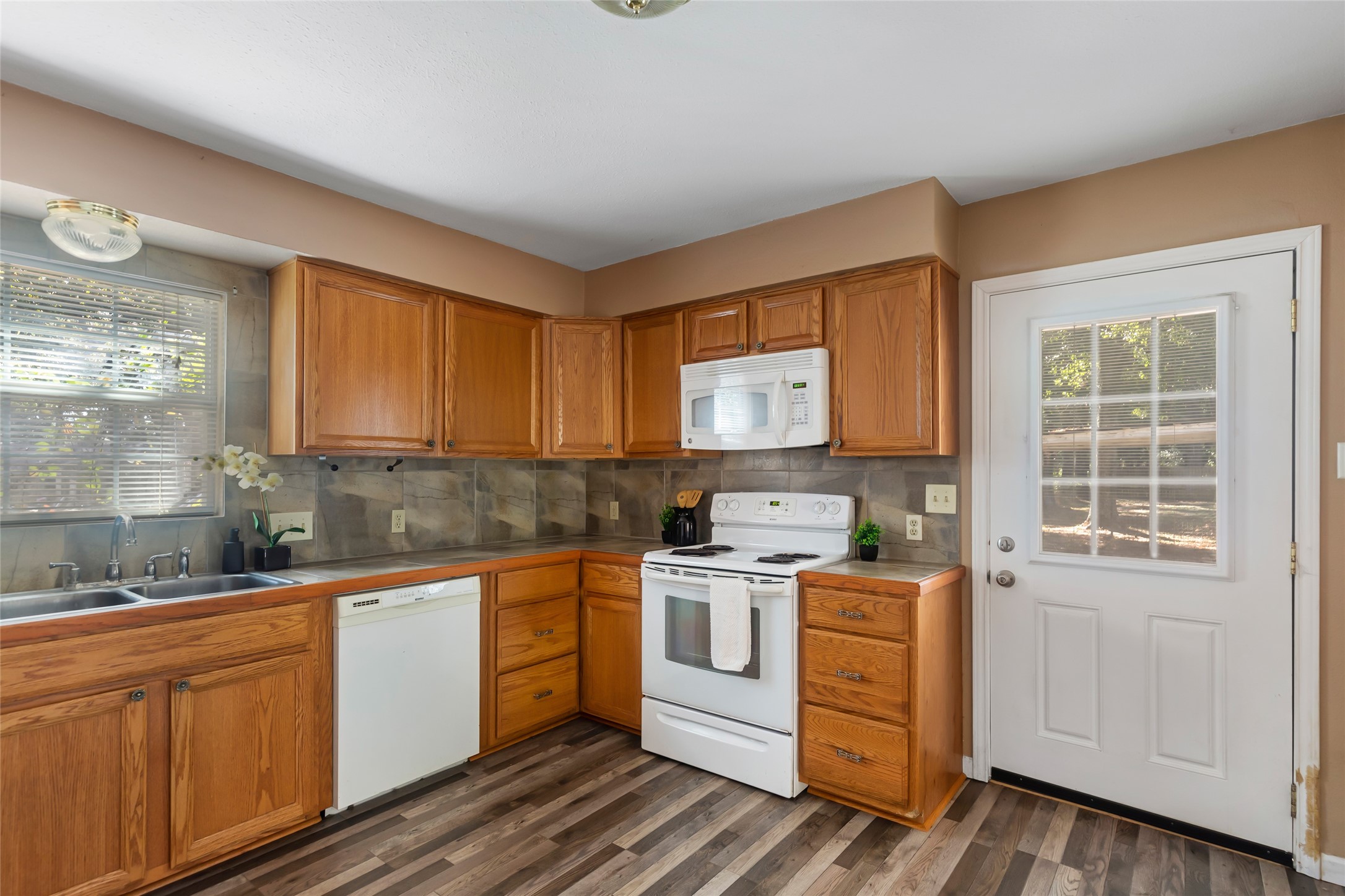 Plenty of cabinet storage, with a range, microwave and dishwasher included.