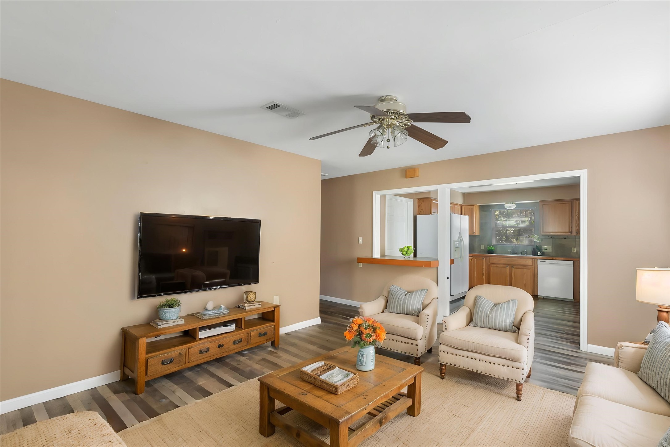 Functional living space with convenient access to the adjoining rooms. (This photo is virtually staged.)