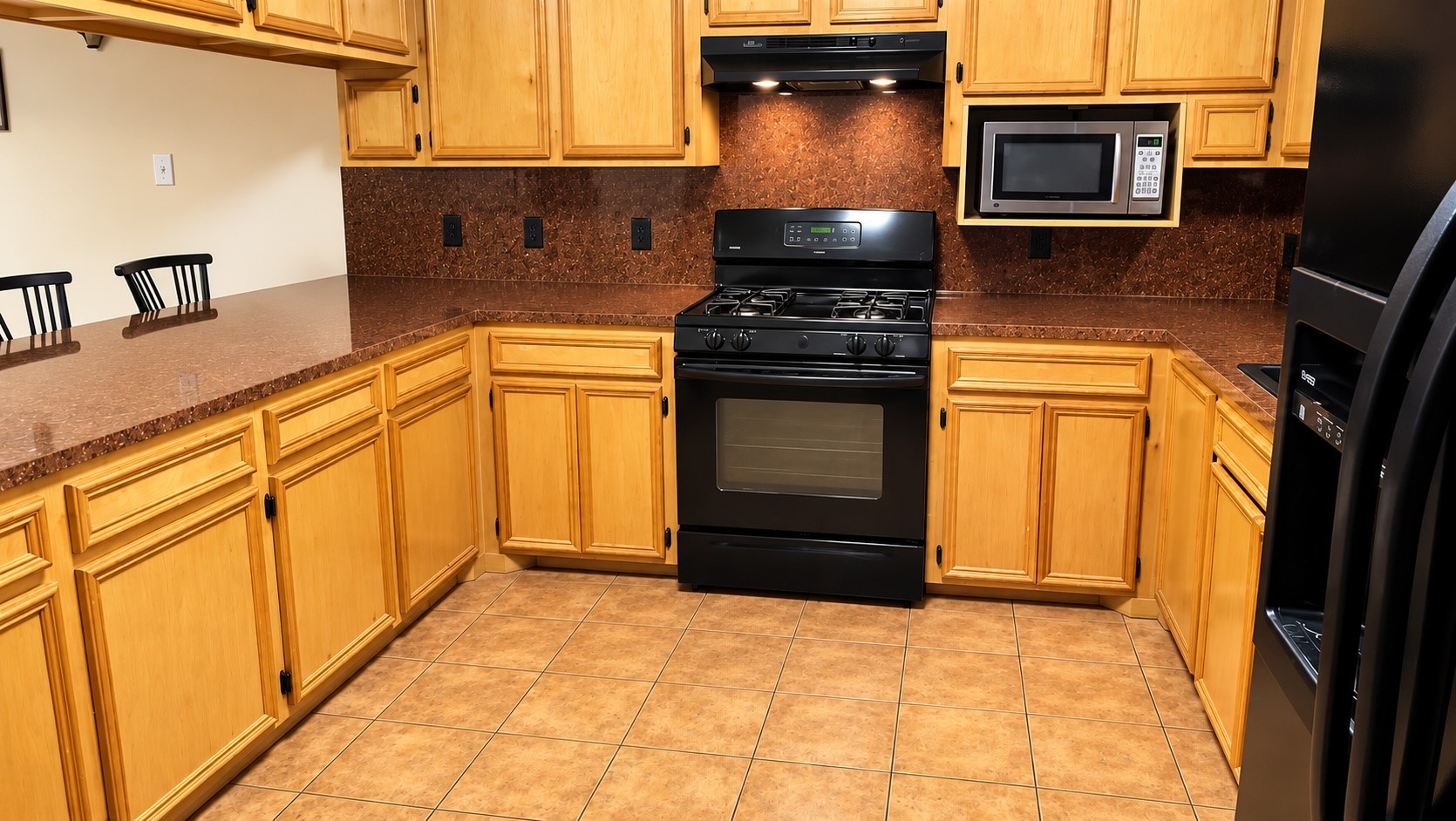 Kitchen with plenty of cabinet and space for cooking.