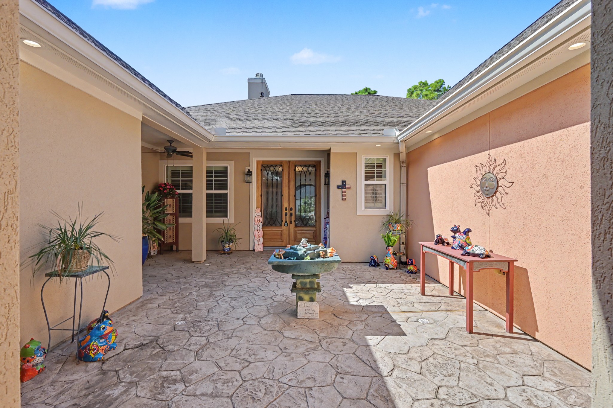 Charming private courtyard with attractive stonework and inviting outdoor space.