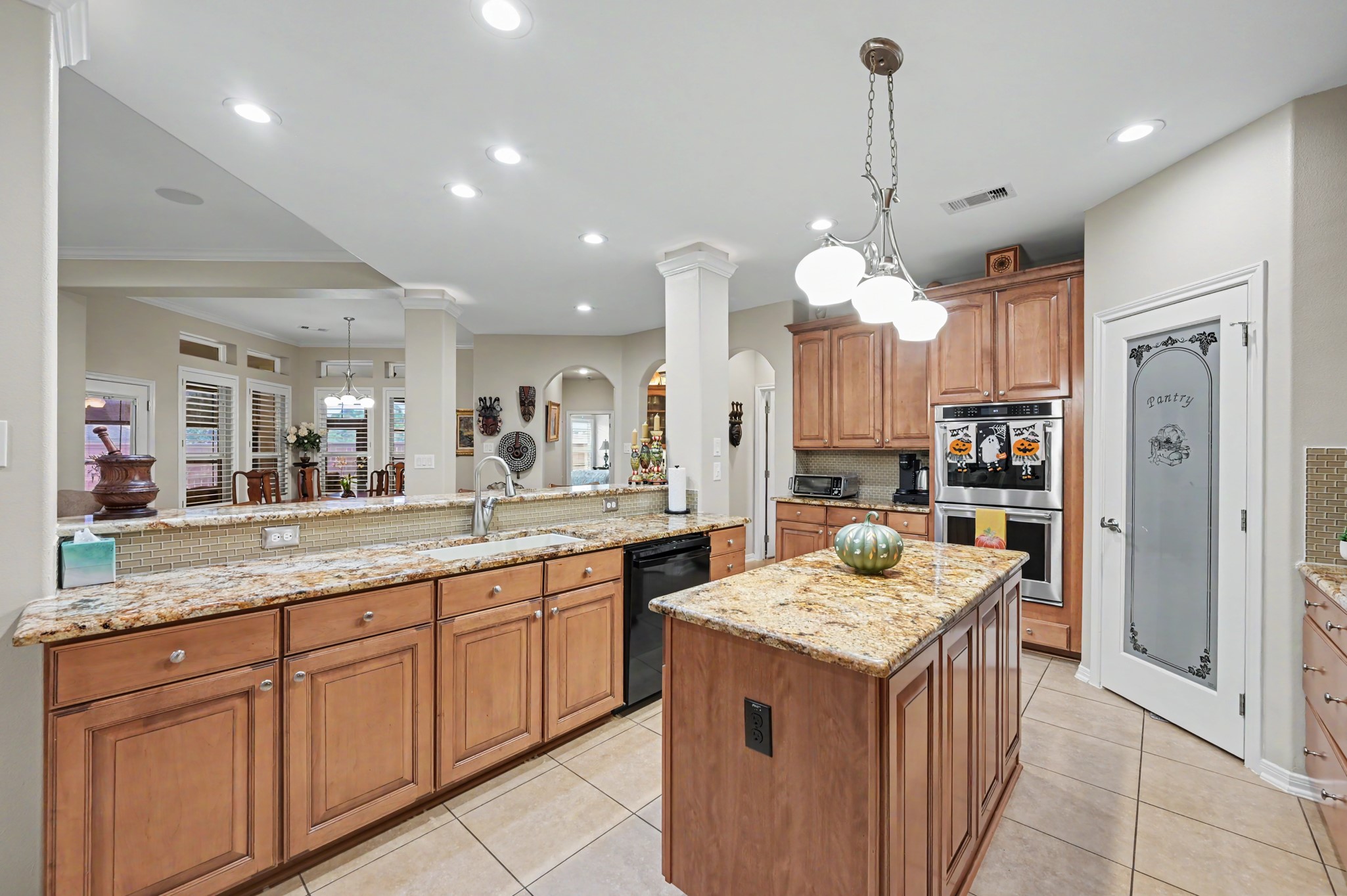 Spacious chef-inspired kitchen with oversized breakfast bar and convenient center island.
