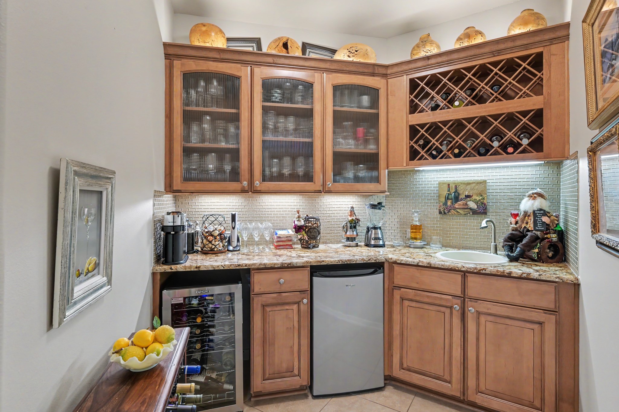 Fantastic beverage bar with wine storage, sink, and dedicated refrigeration.