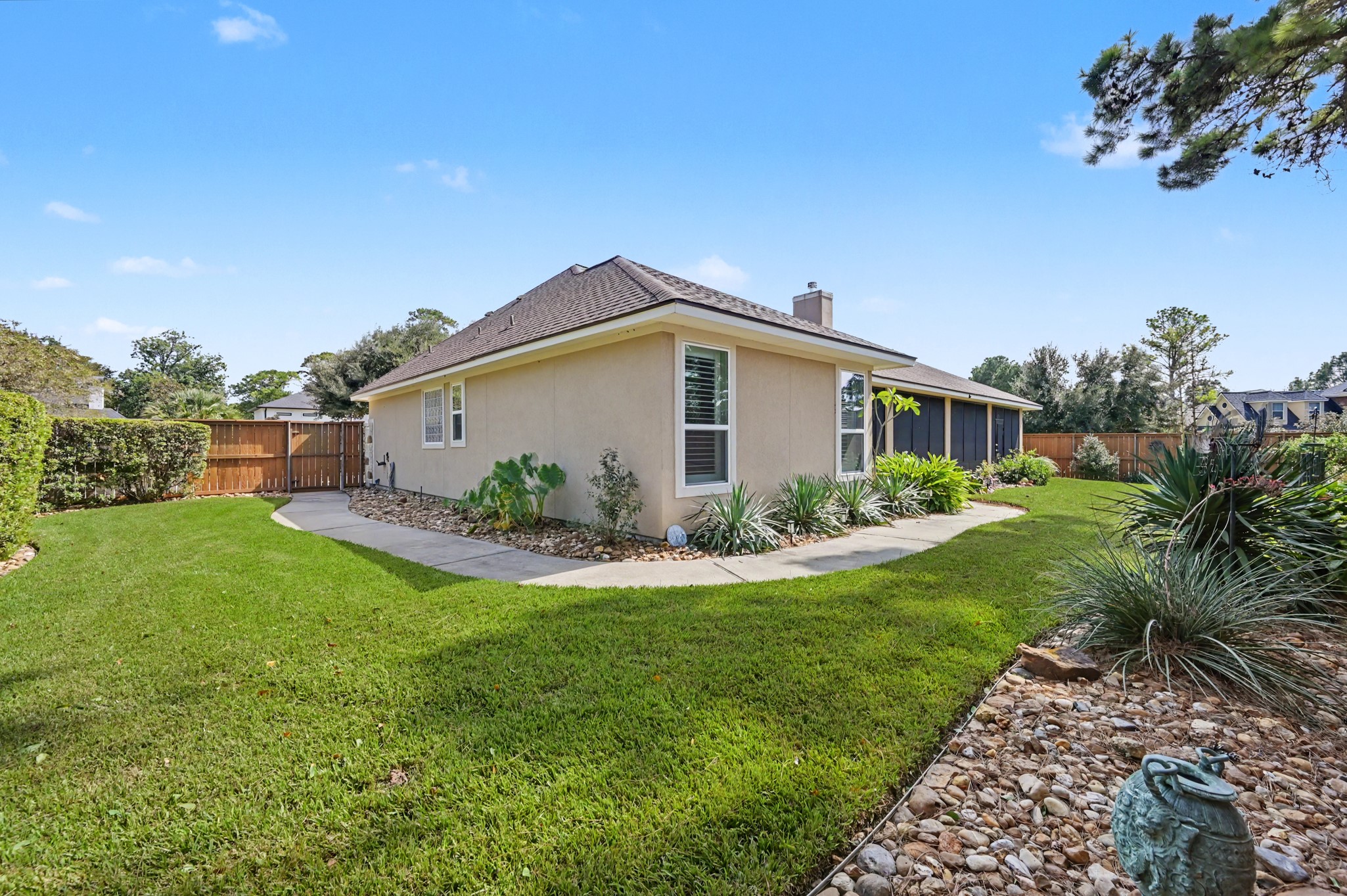 Gorgeous backyard retreat with mature trees and thoughtfully designed landscaping.