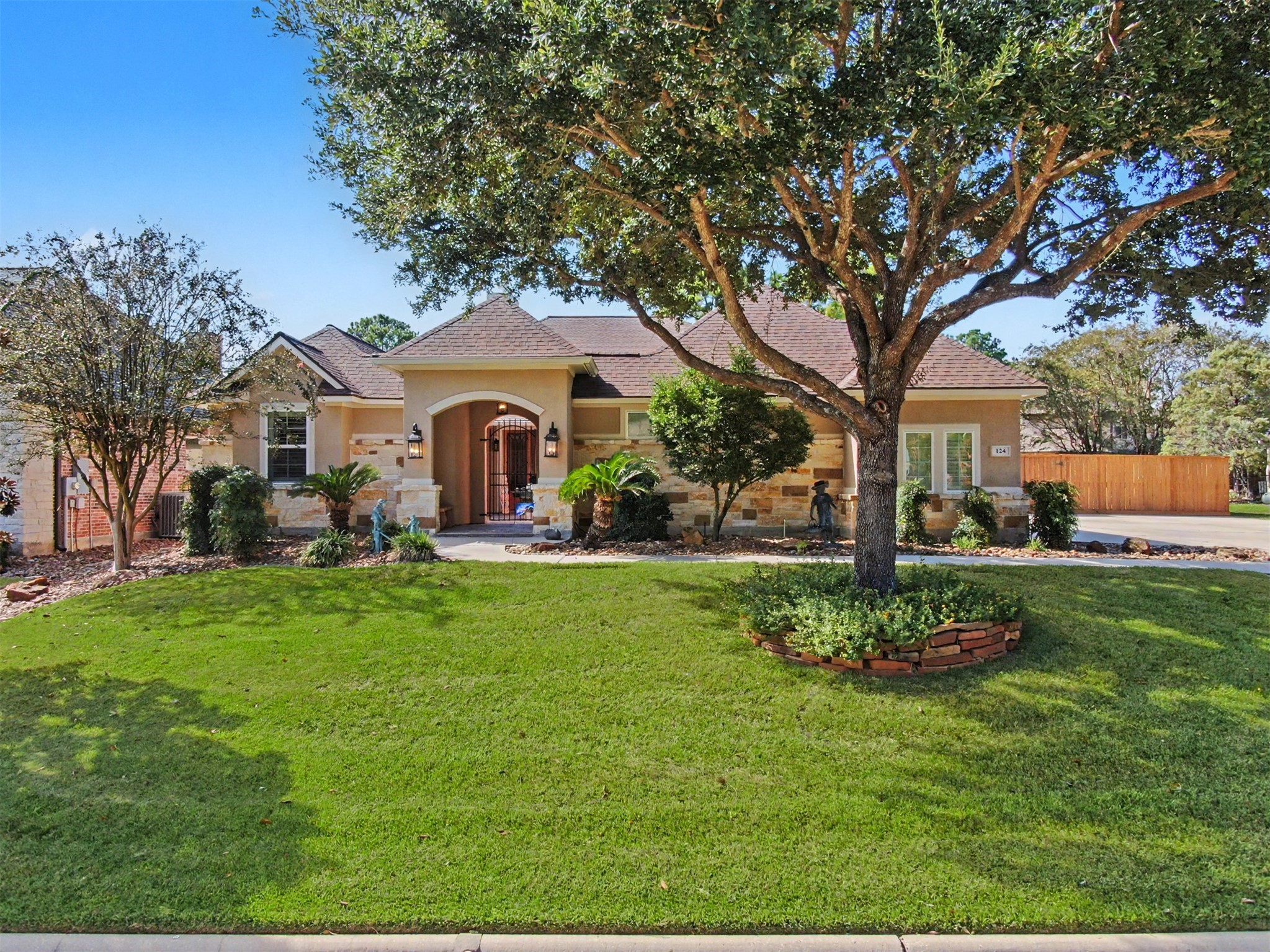 Impressive curb appeal with timeless architecture and attractive landscaping.