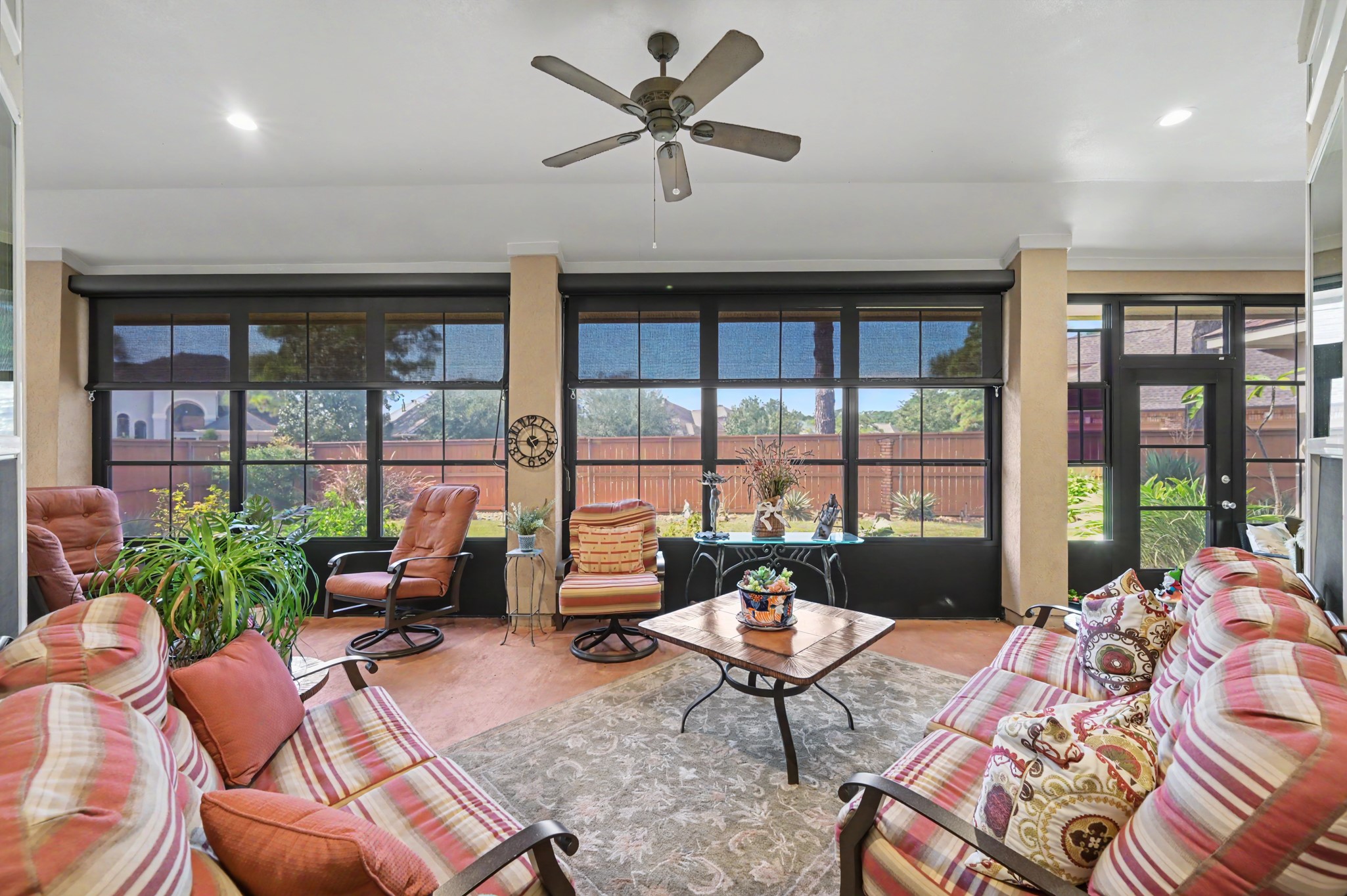 Fabulous screened-in porch offering a relaxing retreat with picturesque backyard views.