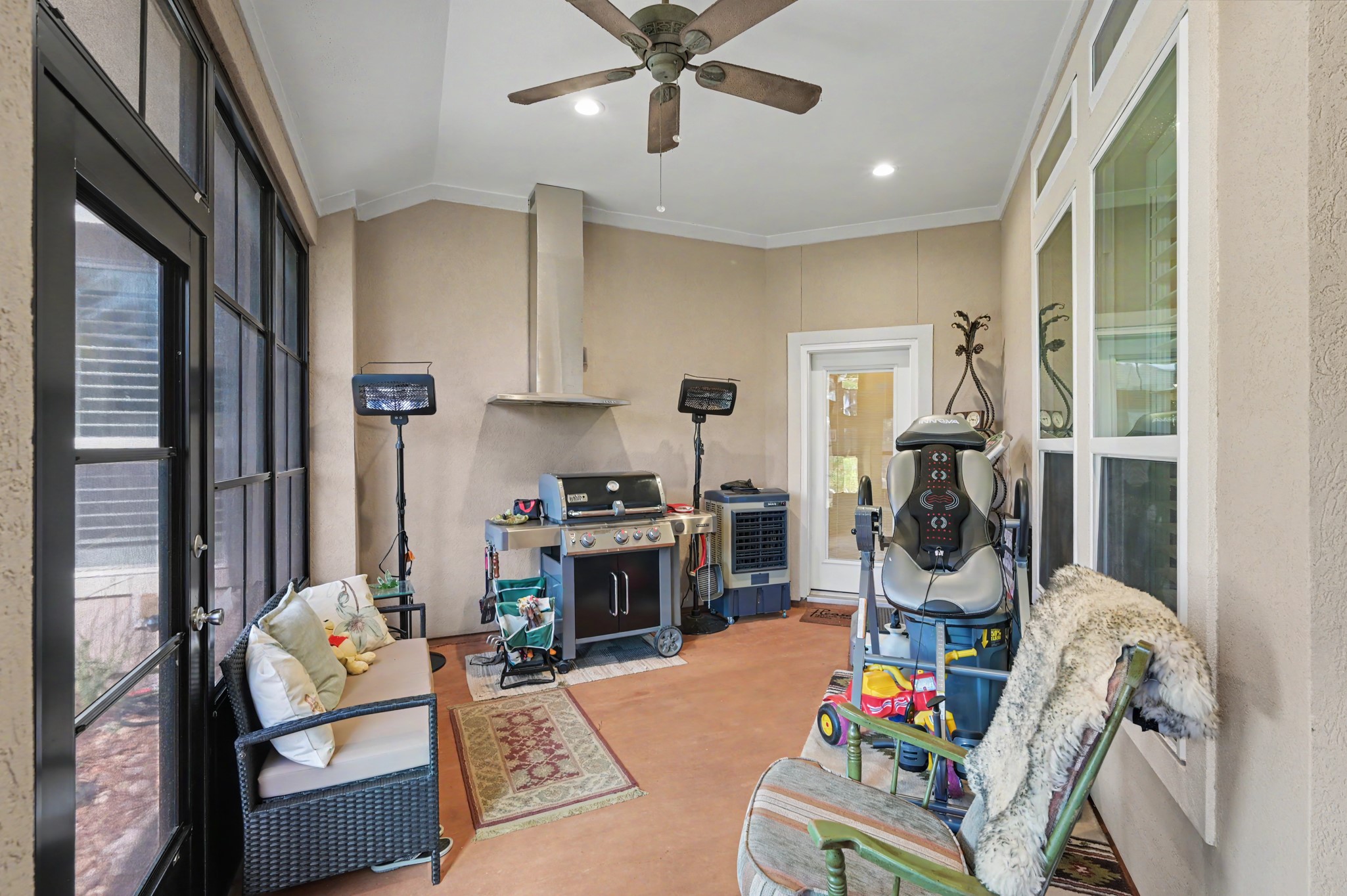 Versatile screened porch with generous space for hobbies, relaxation, or recreation.
