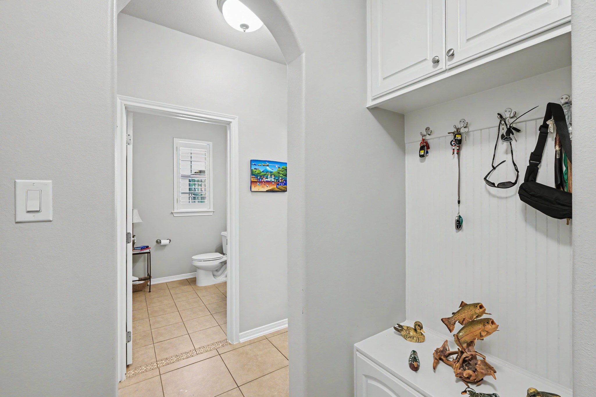 Conveniently located storage and drop zone with easy access to the guest bath.