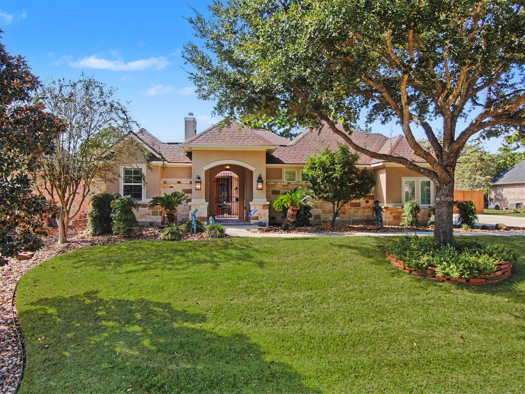 Beautiful custom home with mature shade trees and lush, manicured lawn. Beautiful custom home with mature shade trees and lush, manicured lawn.
