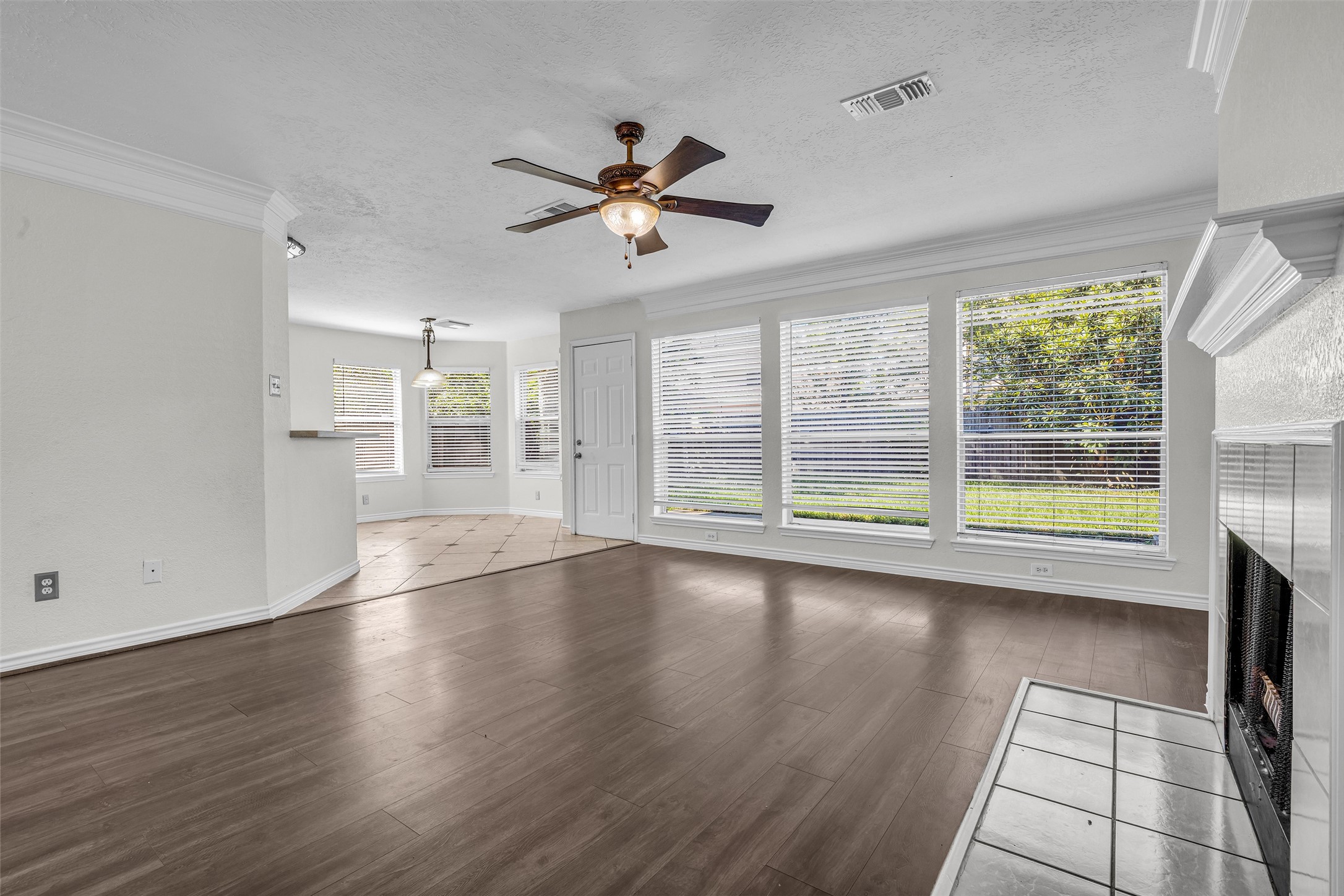 A wall of windows brings the backyard view inside.