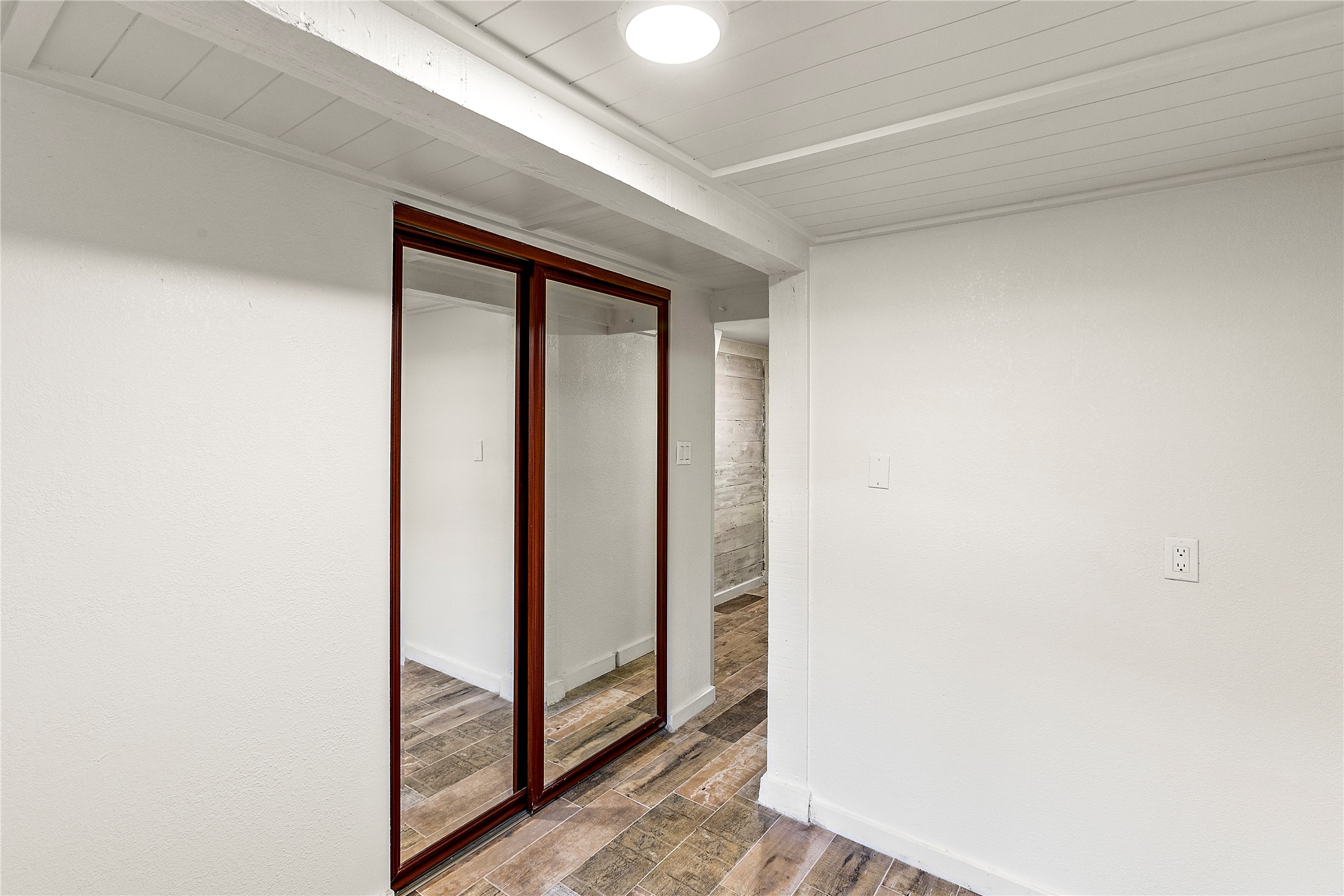 Closet in smaller bedroom