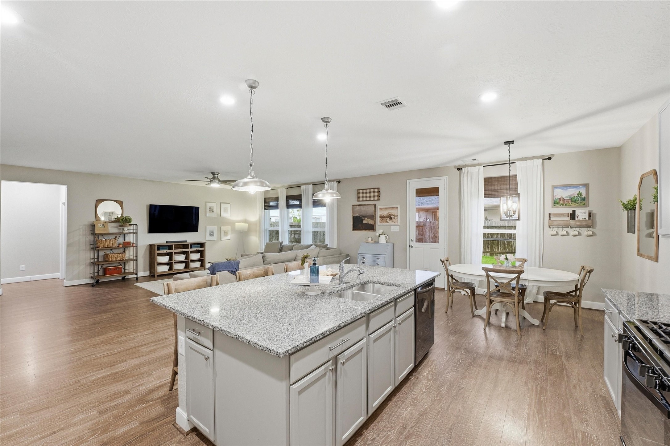 Looking out into the living area and dining area from the kitchen- think of all of the family and friends that could fit in here!