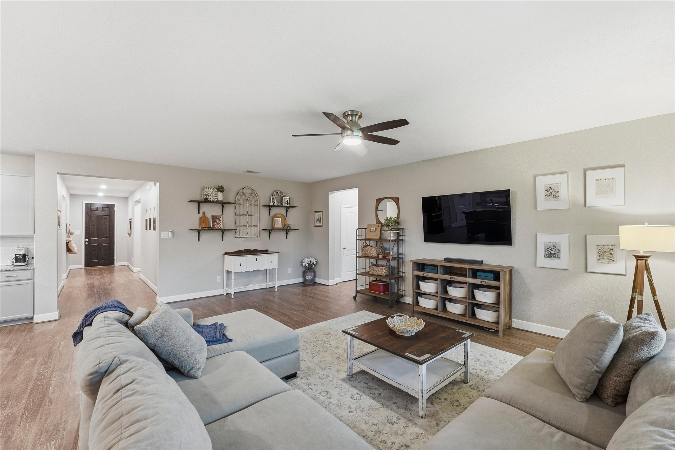 Gather with family and friends in this welcoming living room designed for both relaxation and entertaining.