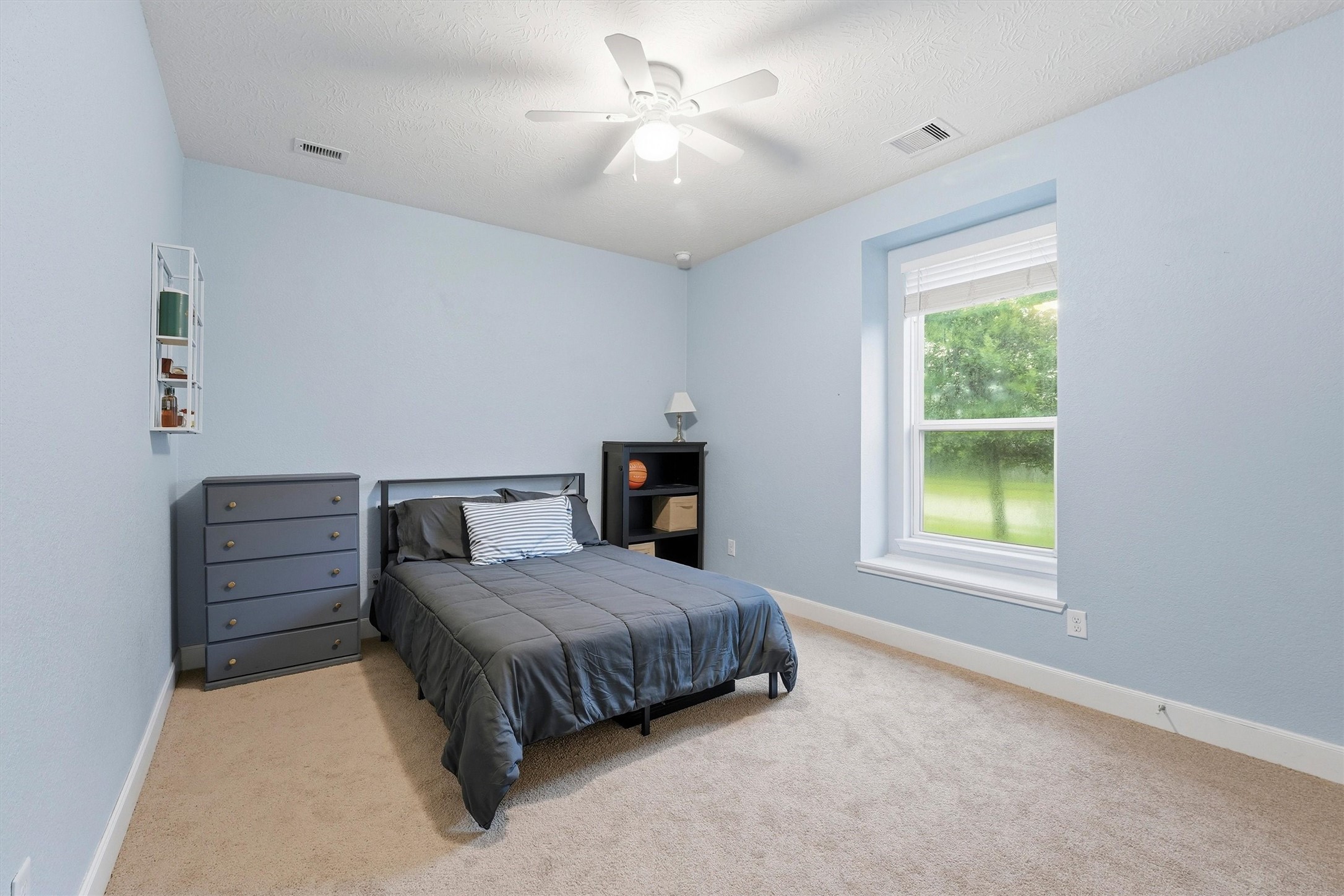 Generously sized secondary bedroom...loads of natural light and wall space!