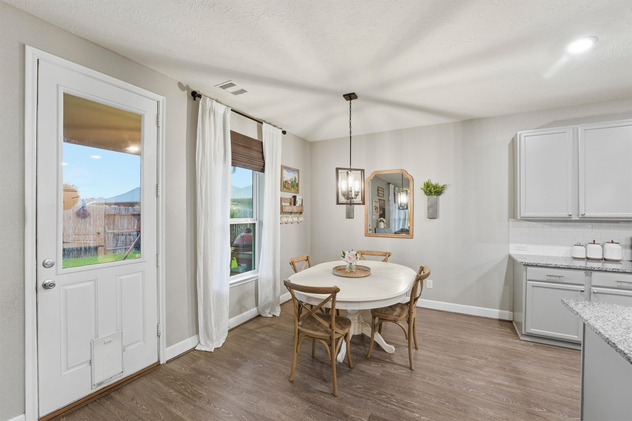 Perfect dining area for quiet mornings and evenings with a view of the backyard.