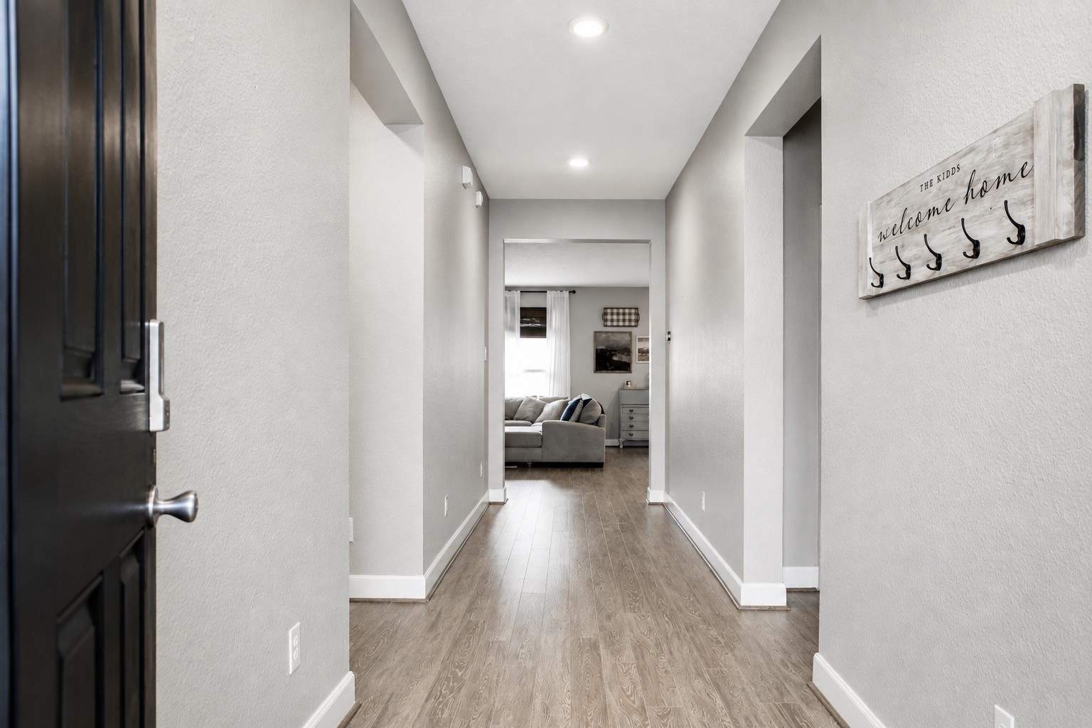 This wide and welcoming entryway invites every guest into the large open living space.