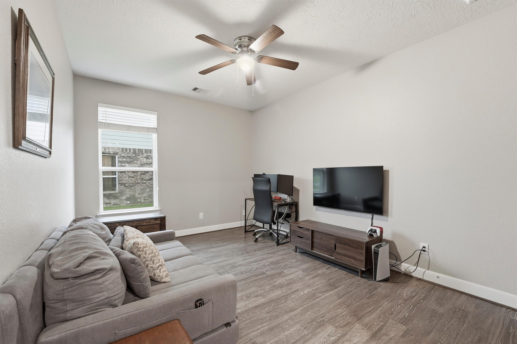 Flexible fourth bedroom is currently used as a home office (closet and sliding barn door shown in next photo).