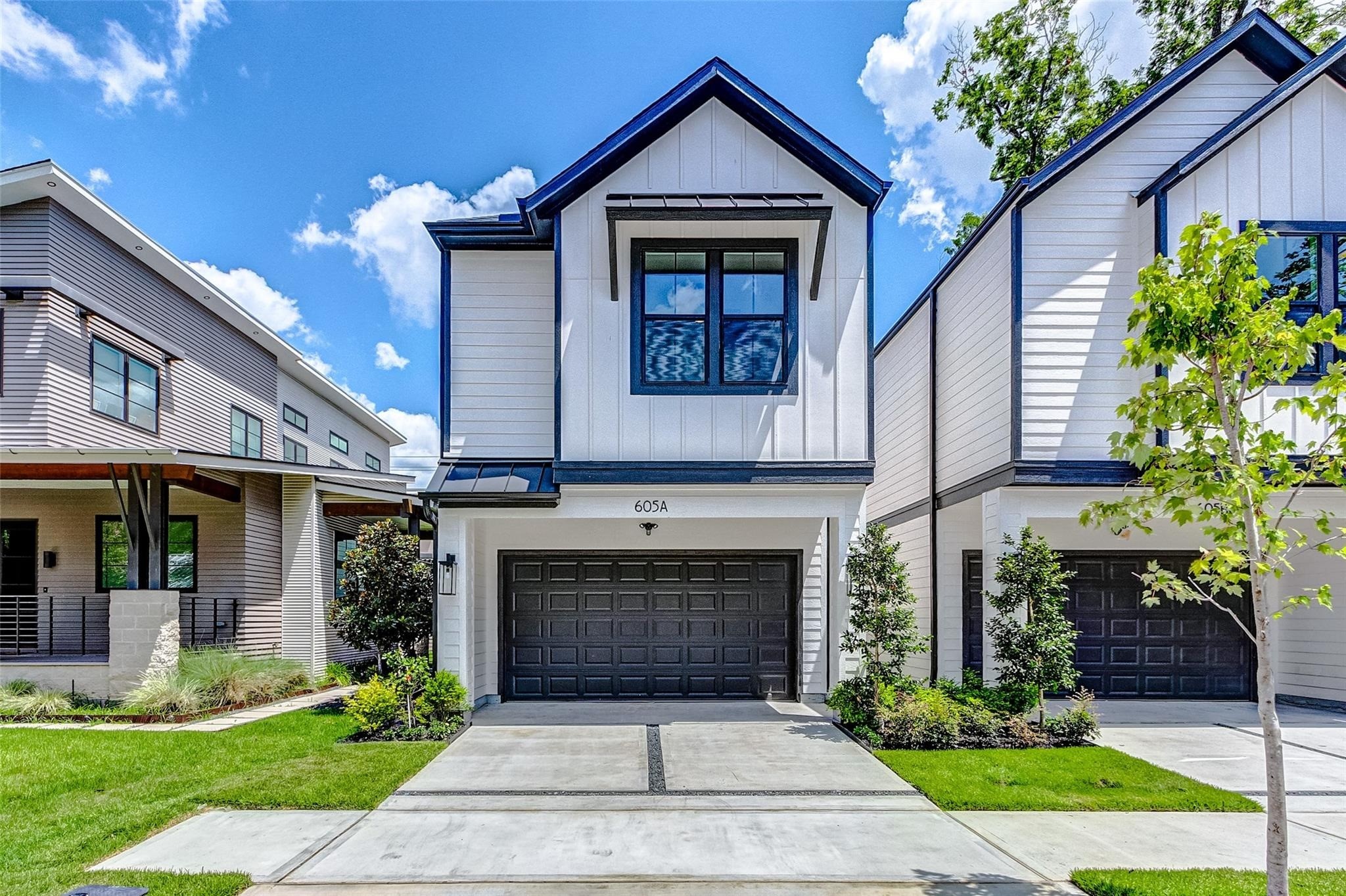 Welcome to this stunning, contemporary home in the prestigious Sunset Heights! This home features striking modern architecture, crisp white siding and bold dark accents.  The eye catching exterior is complimented by clean lines and eye catching curb appeal. The spacious driveway and 2 car attached garage provide convenient parking. Ideally suited for those seeking modern design and sophisticated living in a desirable neighborhood and location!