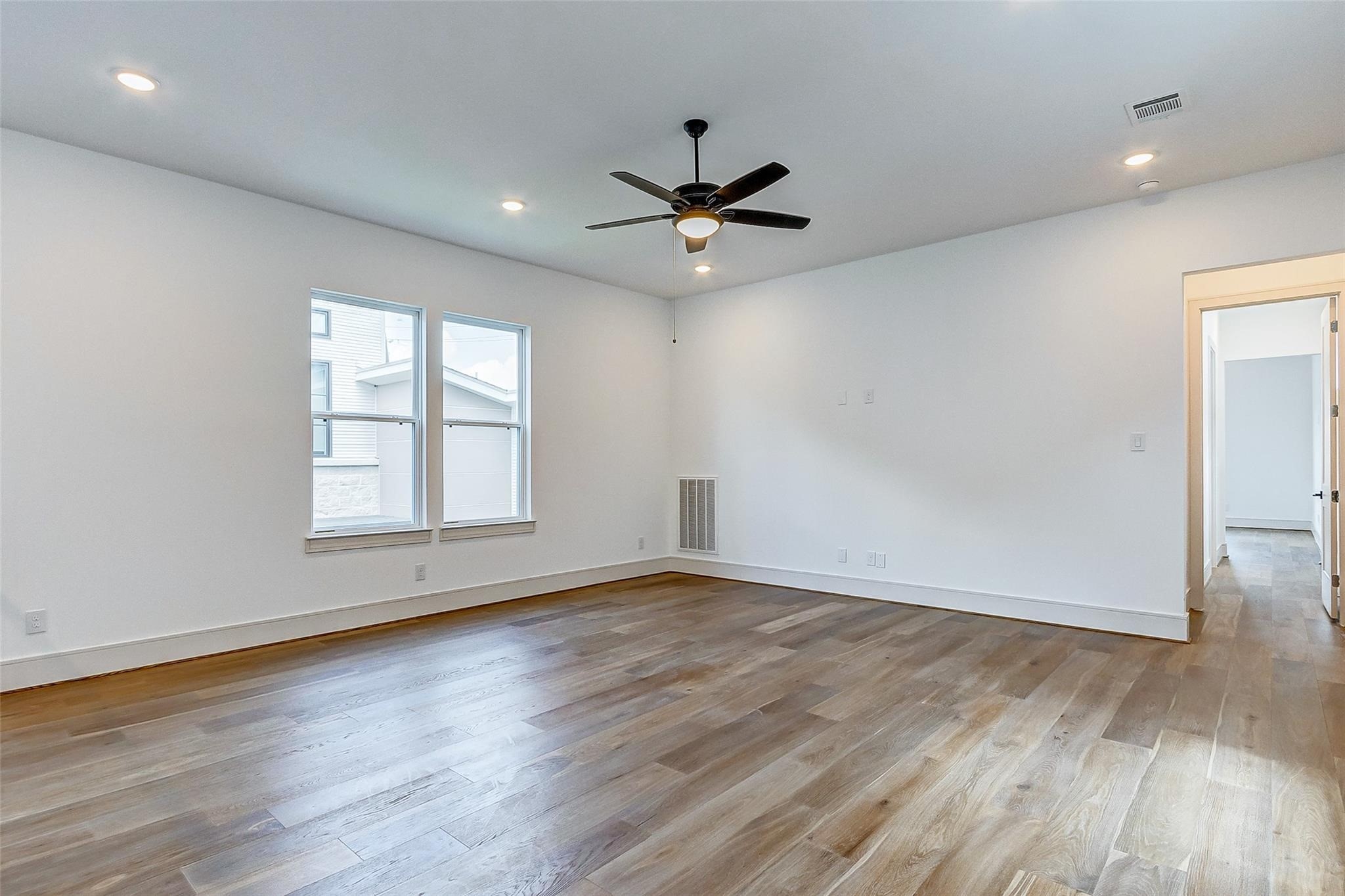 Upstairs you will find a generously sized game room with a ceiling fan and a window providing natural light.  The possibilities for this room are endless!