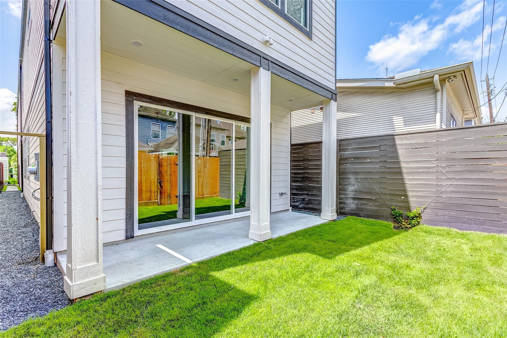 Charming backyard space with a covered patio, perfect for relaxing outdoors, having a BBQ, entertaining, or just enjoying the morning with a fresh cup of coffee. Includes a sprinkler system and privacy fencing.