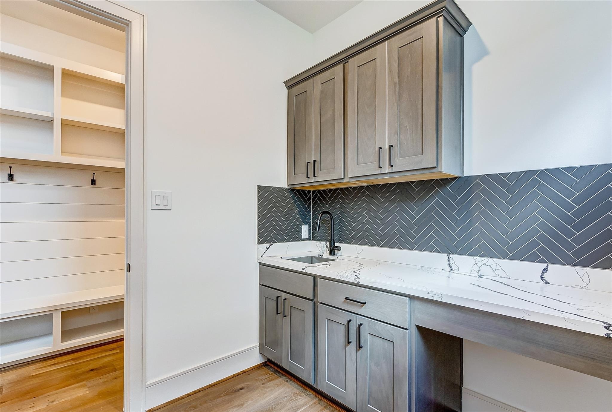 Laundry room seamlessly connected to the mud room.