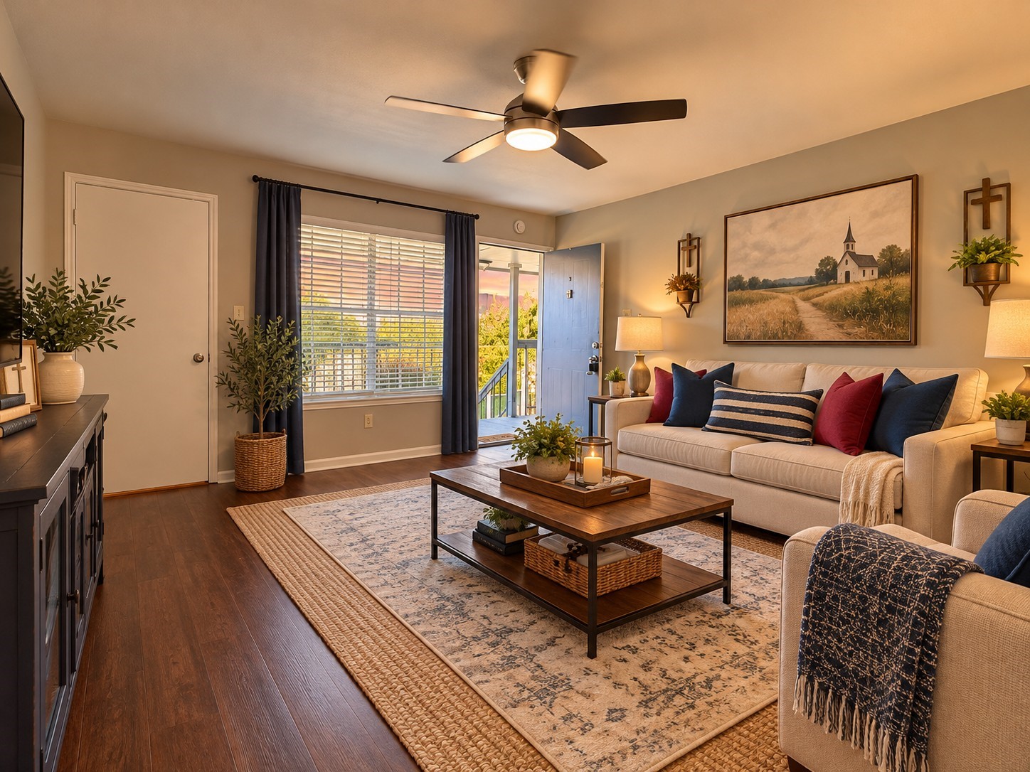 Virtually Staged: Spacious living area featuring vinyl plank flooring, a ceiling fan, and a large window providing natural light. Virtually staged to showcase comfortable seating and furniture arrangements.