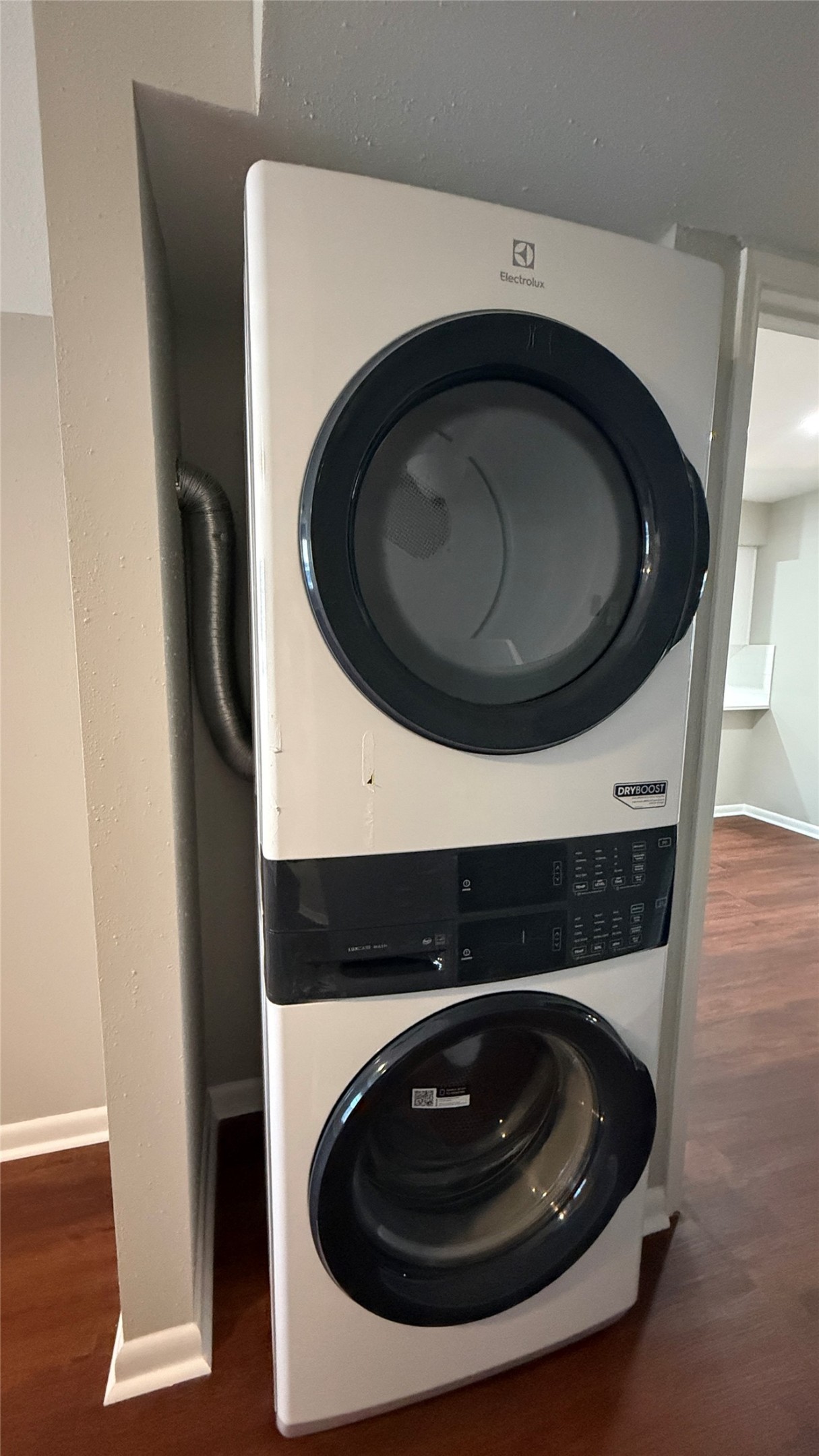 Convenient stacked Electrolux washer and dryer included with the rental.