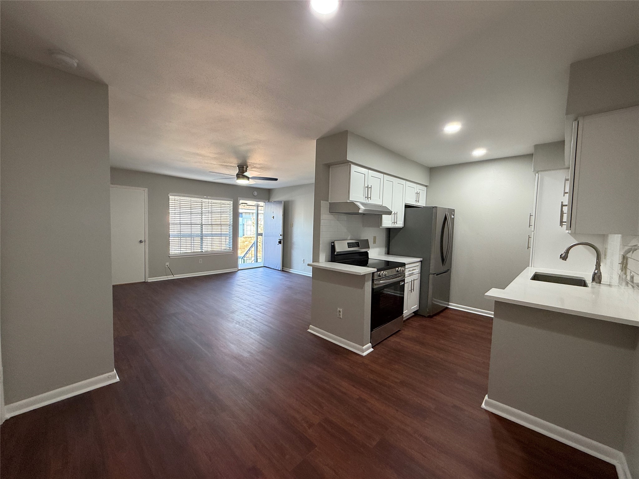 Inviting dining area conveniently situated adjacent to the kitchen, offering a comfortable space for everyday meals and entertaining. The open layout creates a seamless connection between the dining, kitchen, and living areas.
