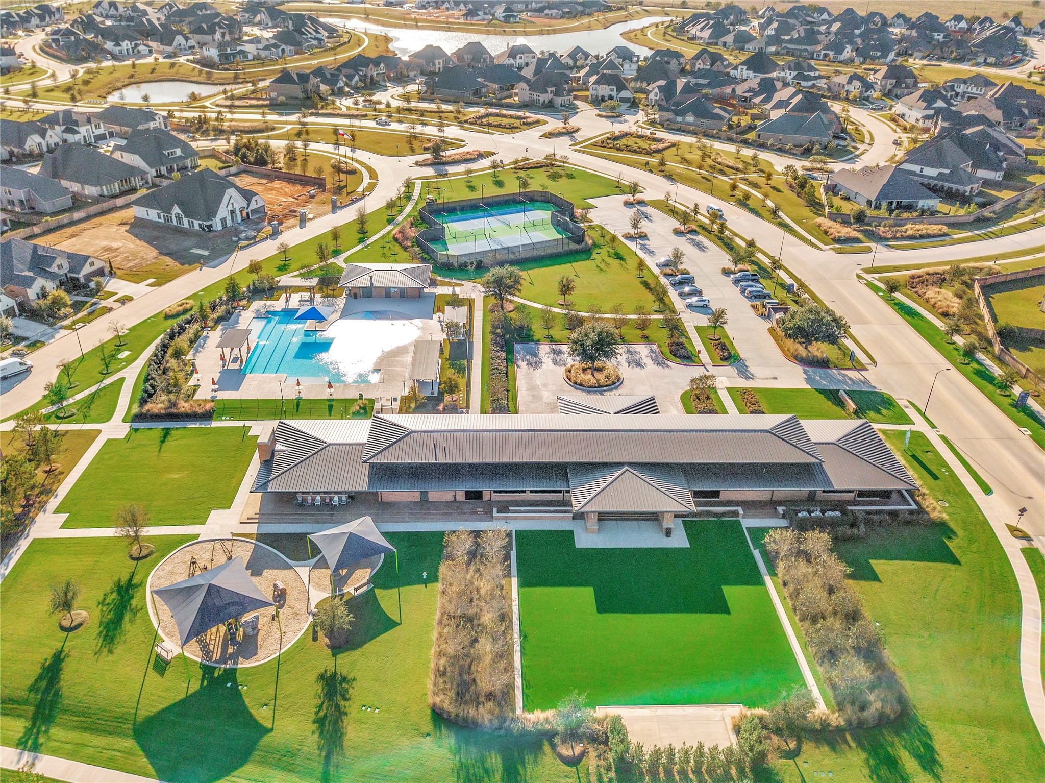 Resort-style recreation at Elyson features a sparkling community pool, lighted tennis courts, scenic walking paths, and expansive green spacescreating the perfect setting for staying active, enjoying the outdoors, and connecting with neighbors in this thoughtfully designed Katy community.